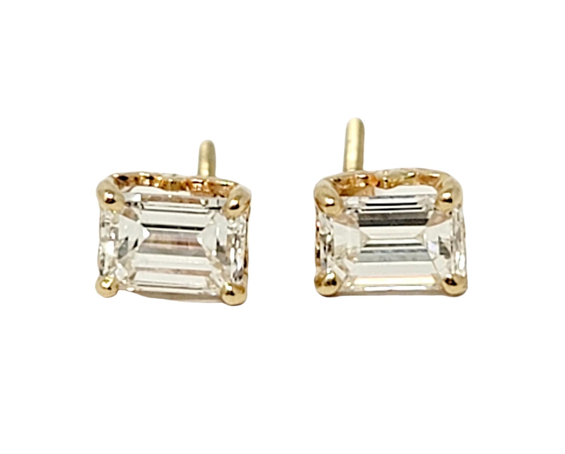 These timeless diamond solitaire stud earrings will become your new everyday earrings! These gorgeous rectangular diamond studs are the epitome of minimalist elegance. They each feature a single sparkling emerald cut diamond 4 prong set in polished