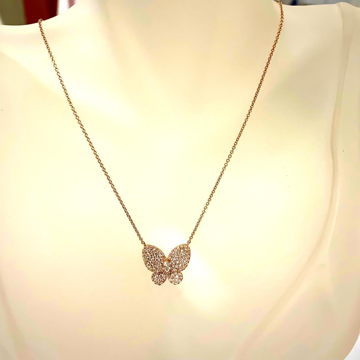 14K Gold Beautiful Pave Set Butterfly Necklace with a Marquise Diamond doubling as the body with total weight of 0.90 Ct.
Size 20mm x 18mm
Chain Length: 15 inch
Total Diamond Weight: 0.90 Ct