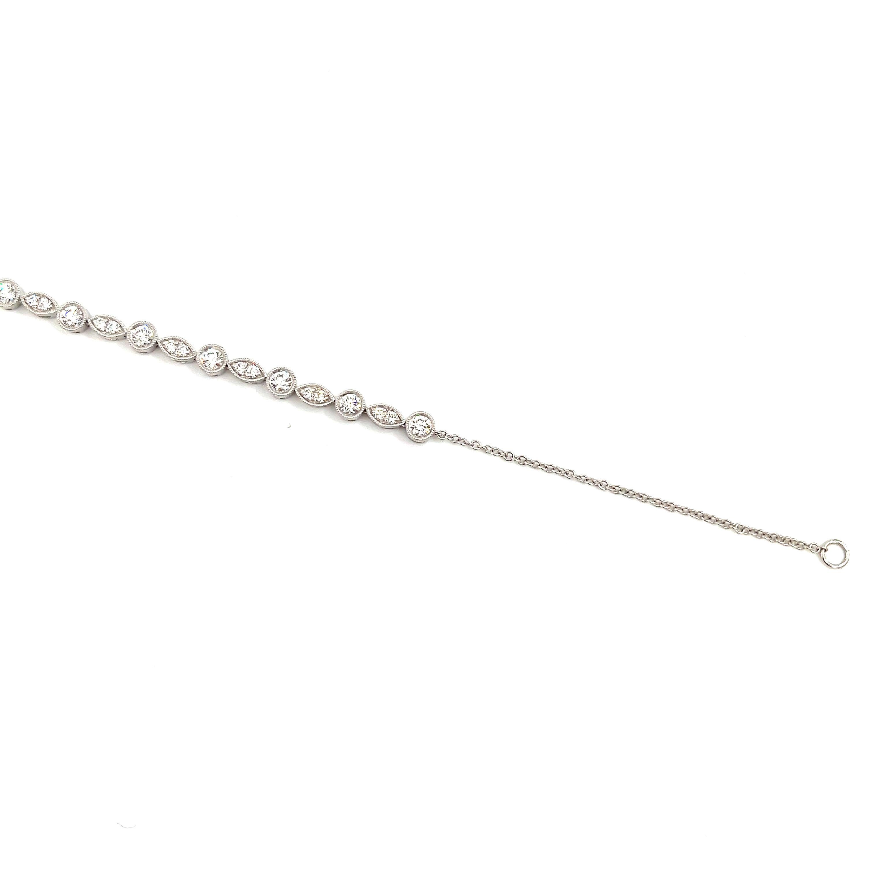 This stunning diamond bracelet features 28 diamonds set in 18k white gold. The bracelet is 8 inches long and can be resized to fit a smaller wrist. The diamonds boast a color of E/F and VS1/VS2 in clarity. A gorgeous piece to wear everyday or to add