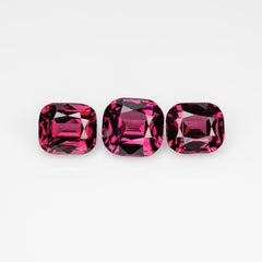 10.5 cts, Faceted rhodolite garnet cushion set the pair's