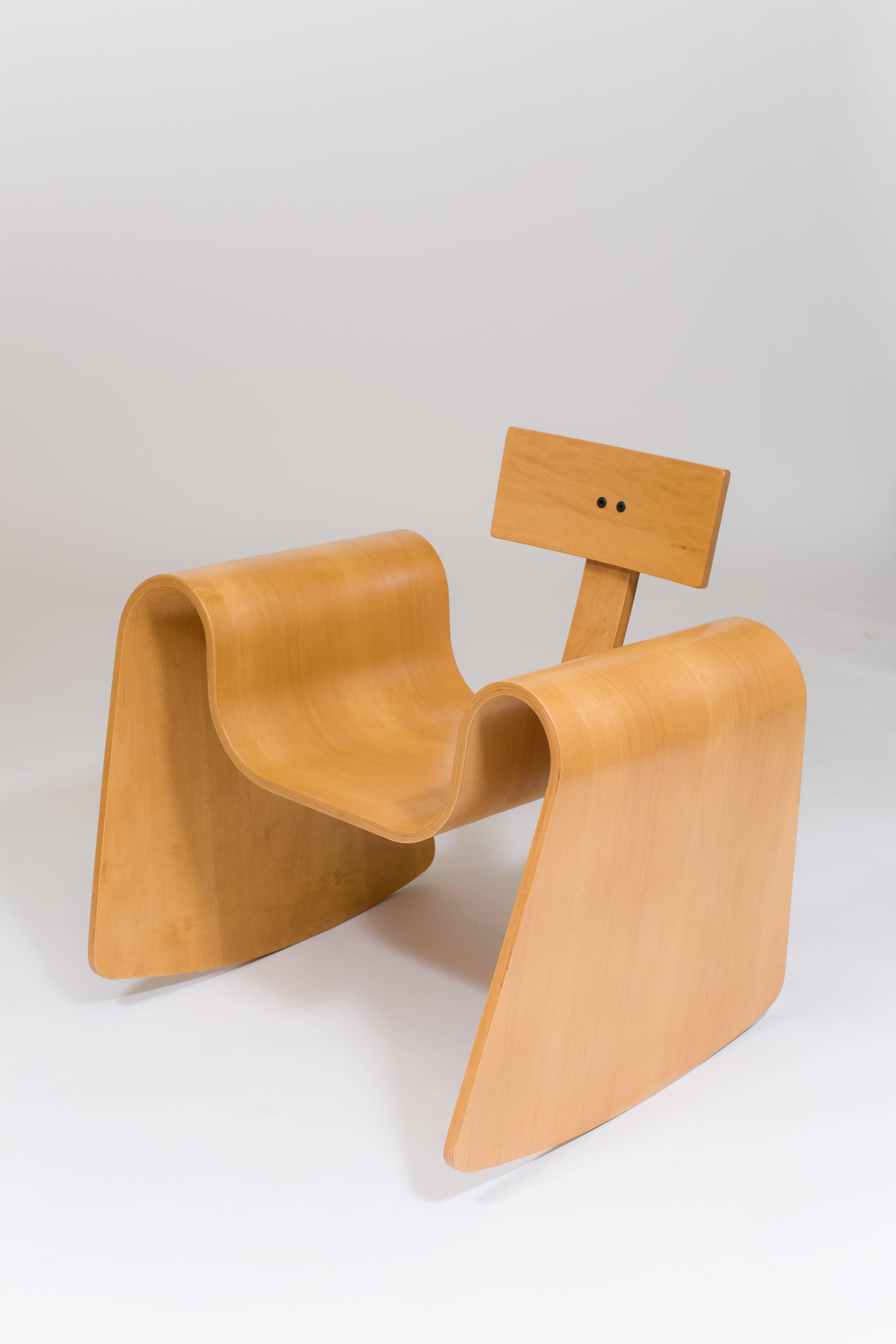 The 105 rocking chair is made from thin sheets of birch and maple that have been compressed, molded and cut into a seamless, contoured rocking chair.

The complex curves in this rocker are made possible by a technology called Radio Frequency Gluing