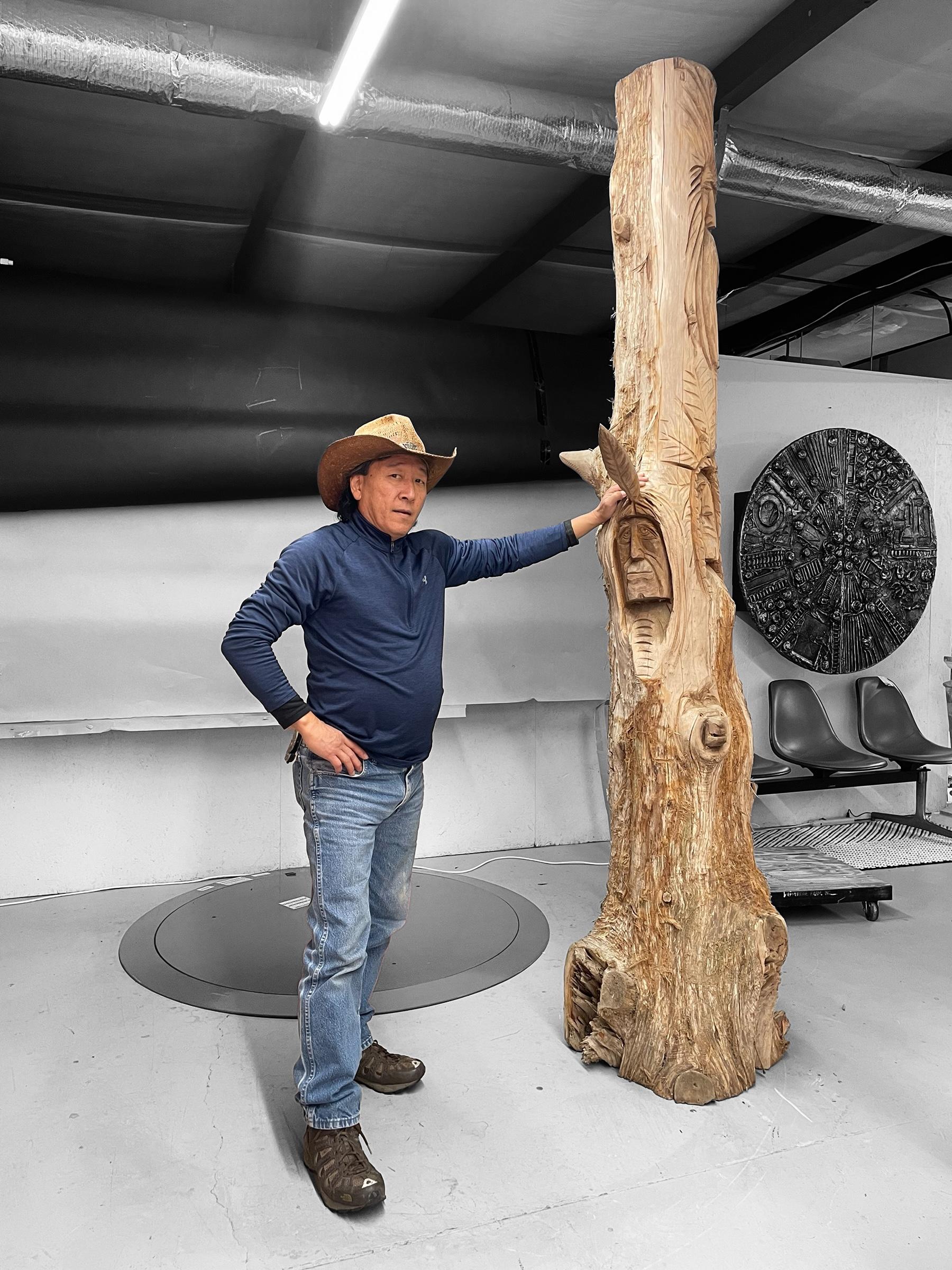 This massive totem stands nearly 9 feet tall.  Covered from top to bottom in bearded wise men, Native American chiefs,  enchanted spirits and woodland animals.  This magical monument is captivating and inspiring.  This traditional style folk art is
