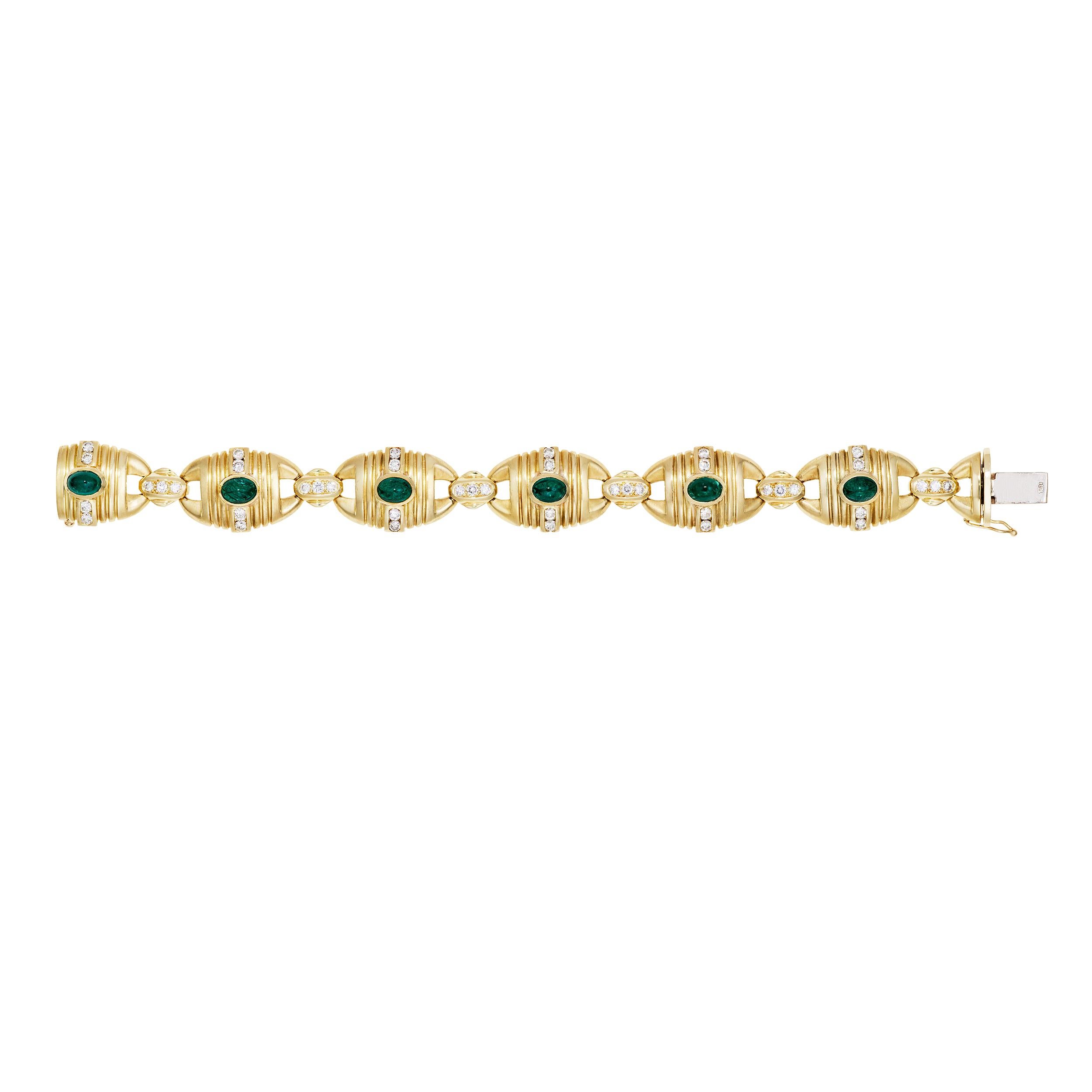 A substantial vintage brushed solid 18 Karat Yellow Gold link bracelet with 6 Natural Oval Cabochon Emeralds, Bezel Set, deep and rich green color all measuring 7.0 x 5.0 mm complimented by 18 Pave Set Diamonds, E/F Color, VVS1 - VS1 Clarity with