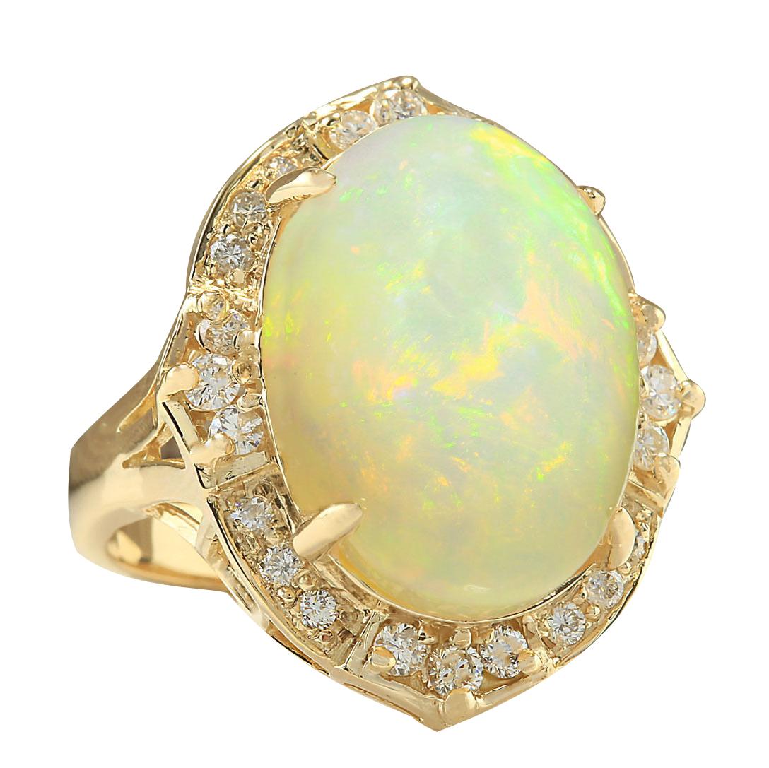 10.50 Carat Natural Opal 14 Karat Yellow Gold Diamond Ring
Stamped: 14K Yellow Gold
Total Ring Weight: 9.0 Grams
Total Natural Opal Weight is 9.75 Carat (Measures: 18.00x13.00 mm)
Color: Multicolor
Total Natural Diamond Weight is 0.75 Carat
Color: