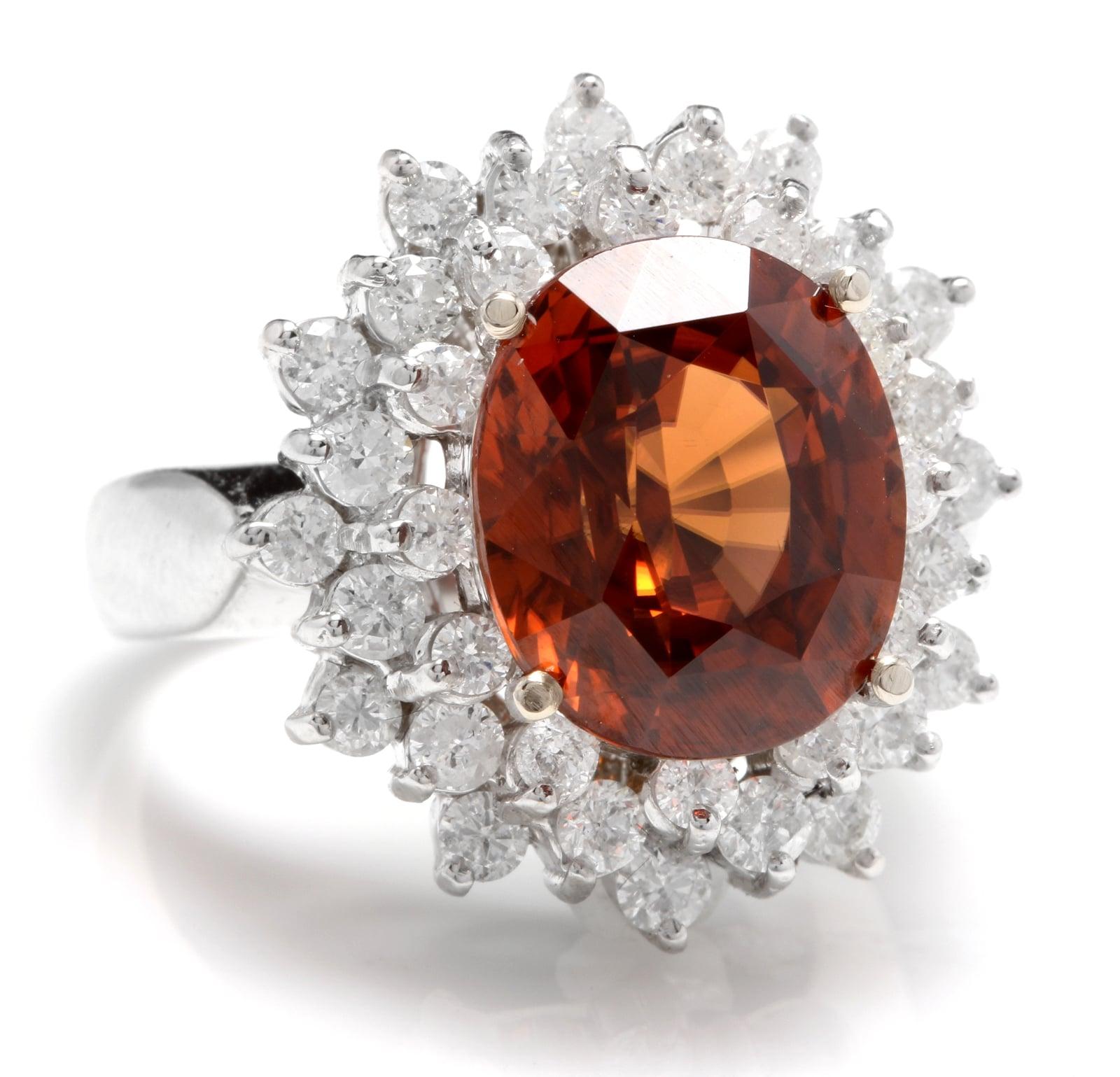 10.50 Carats Natural Very Nice Looking Orange Zircon and Diamond 14K Solid White Gold Ring

Suggested Replacement Value: Approx. $8,900.00

Total Natural Oval Cut Zircon Weight is: Approx. 9.00 Carats 

Zircon Measures: Approx. 12.00 x