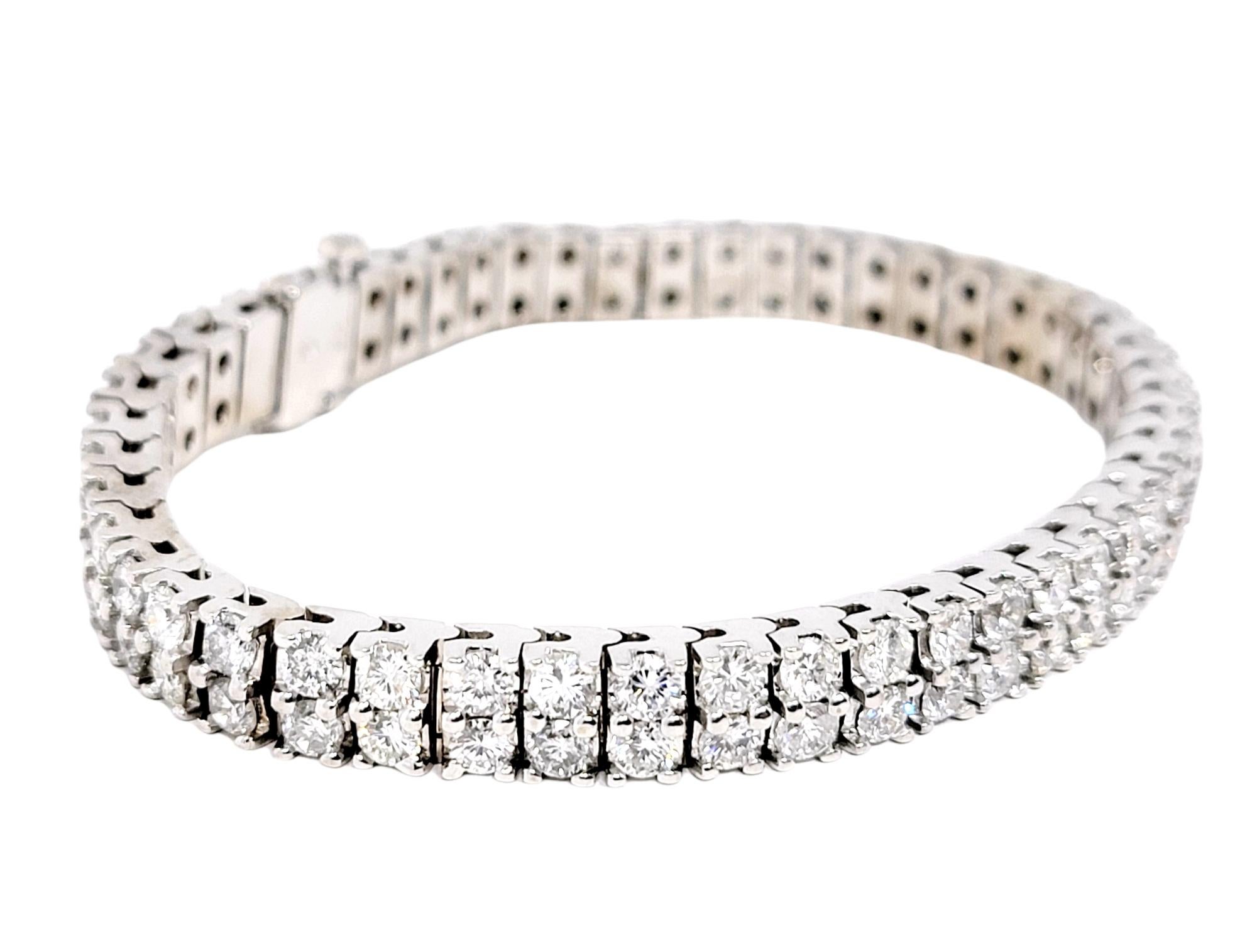 This super sparkly modern diamond tennis bracelet is simply stunning! The multi row design glitters and glows on the wrist, exuding contemporary elegance. Featuring 100 round brilliant diamonds dazzling throughout, the icy white stones really pop