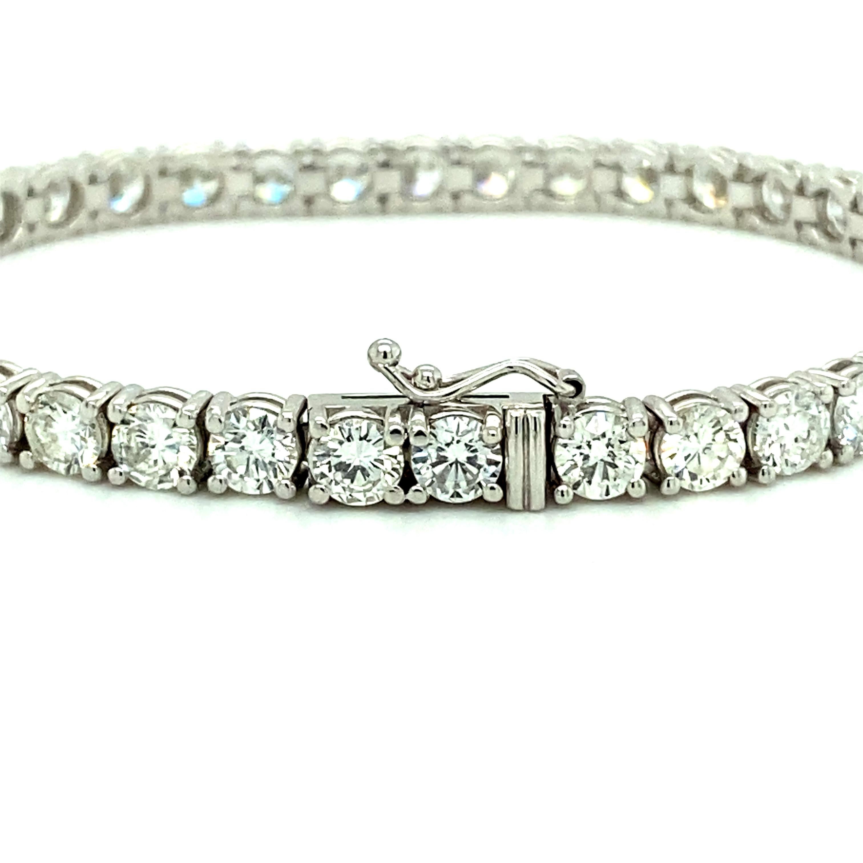 Offered here is a stunning large straight-line tennis bracelet, showcasing 44 natural earth mined excellent quality round diamonds weighing 10.50 carats total, near colorless averaging G-H in color and near flawless averaging VS2-SI1 in clarity.
A