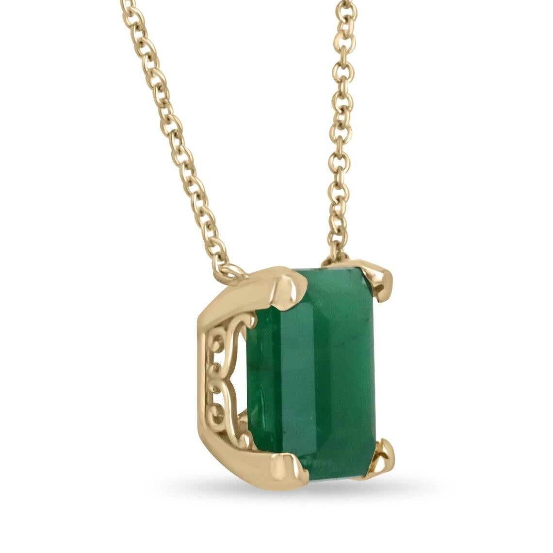 Featured here is a very rare and large 10.50-carat stunning, deep green emerald necklace in fine 14K yellow gold. Displayed in the center is a deep green emerald accented by a simple four-prong gold mount, allowing for the emerald to be shown in