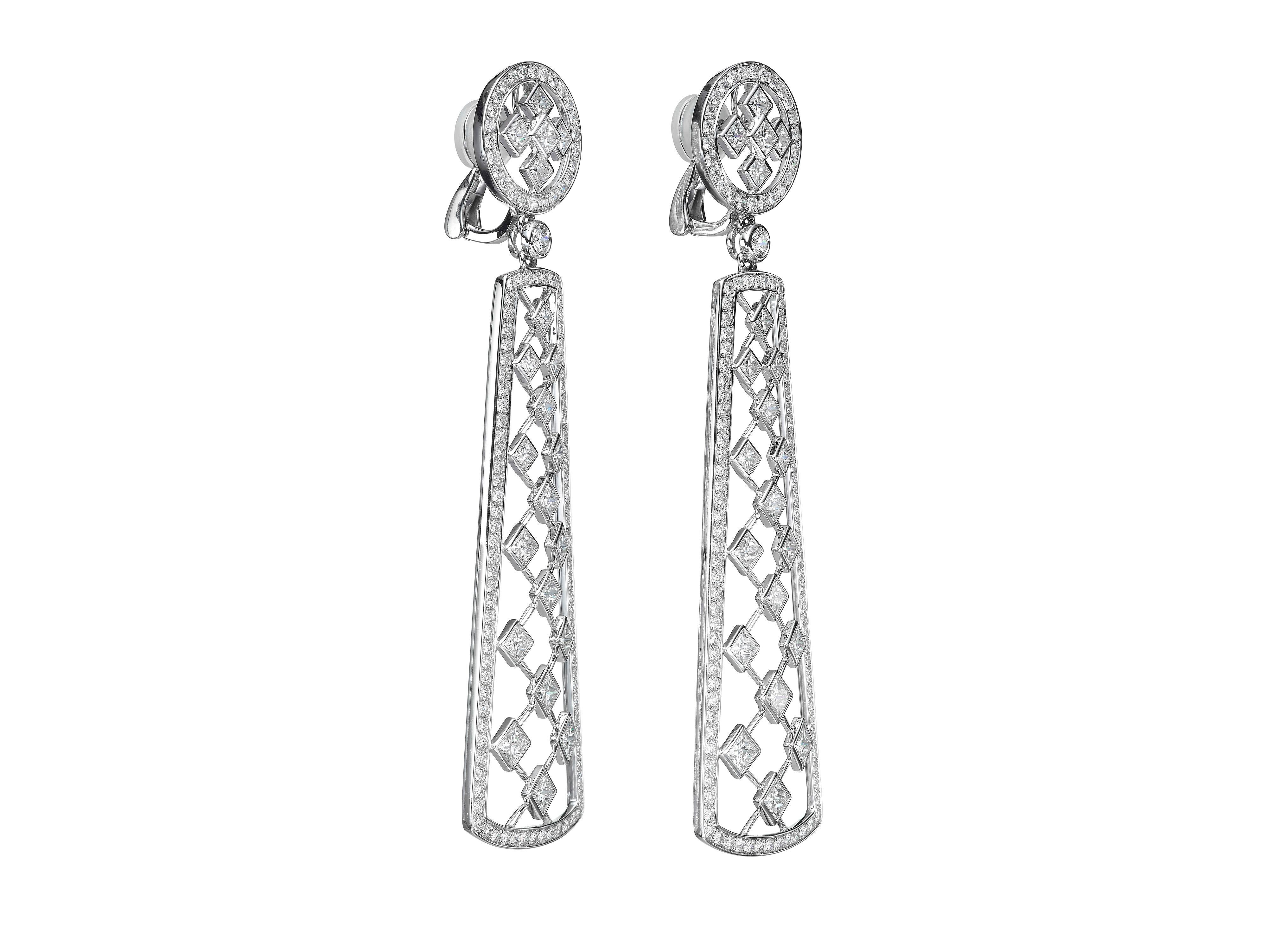 Handmade in 18K white old, Butani's earrings are designed with latticed princess-cut diamonds (totaling 6.64 carats) set in a rectangular drop silhouette of brilliant-cut diamonds (totaling 3.87 carats).  

Composition: 
18K White Gold 
42 Princess