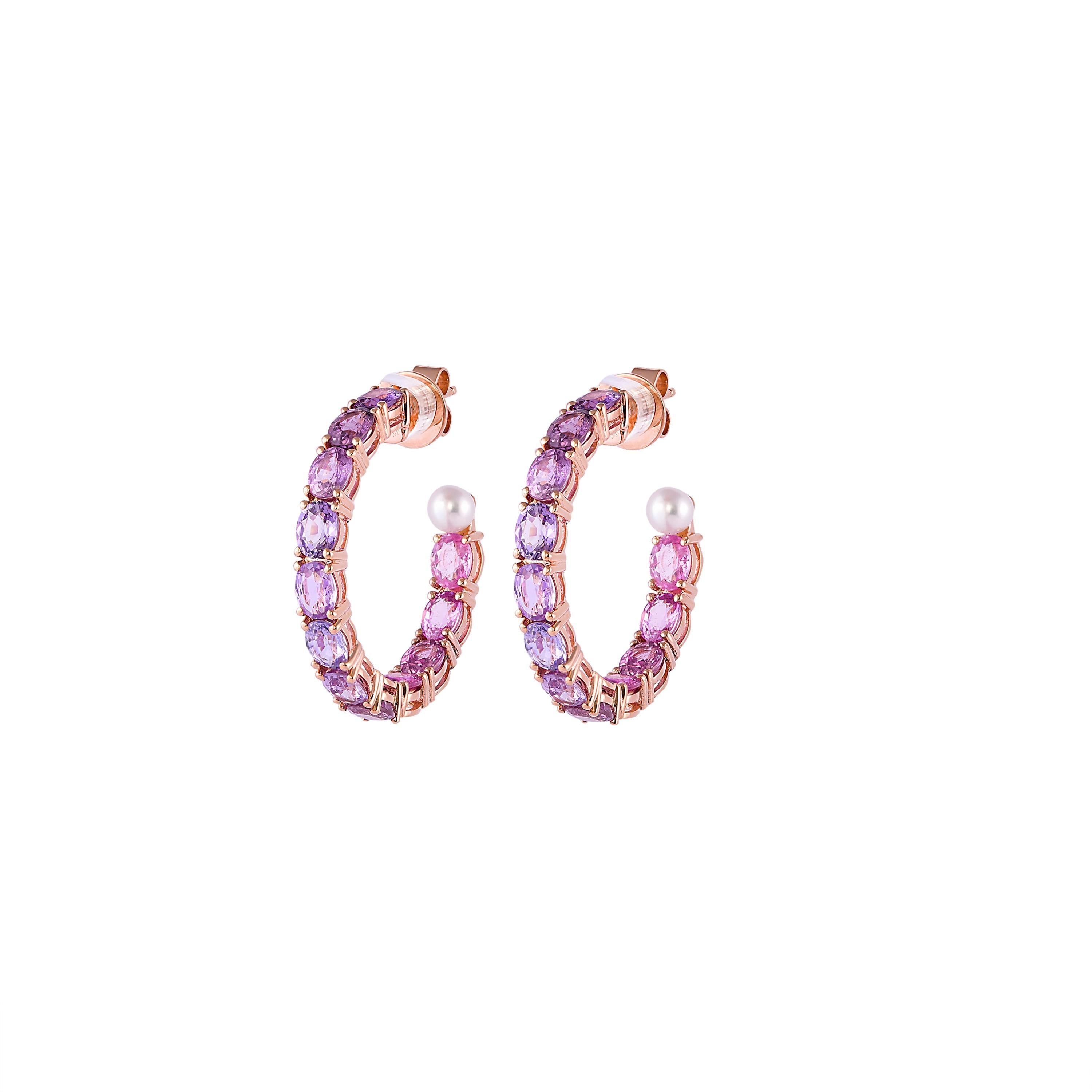 Sunita Nahata presents a collection of simple, classic and dainty sapphire earrings. These earrings in particular feature sparkling purple sapphire hoops with an elegant pearl to accent the gemstones. These are light and comfortable and are suitable