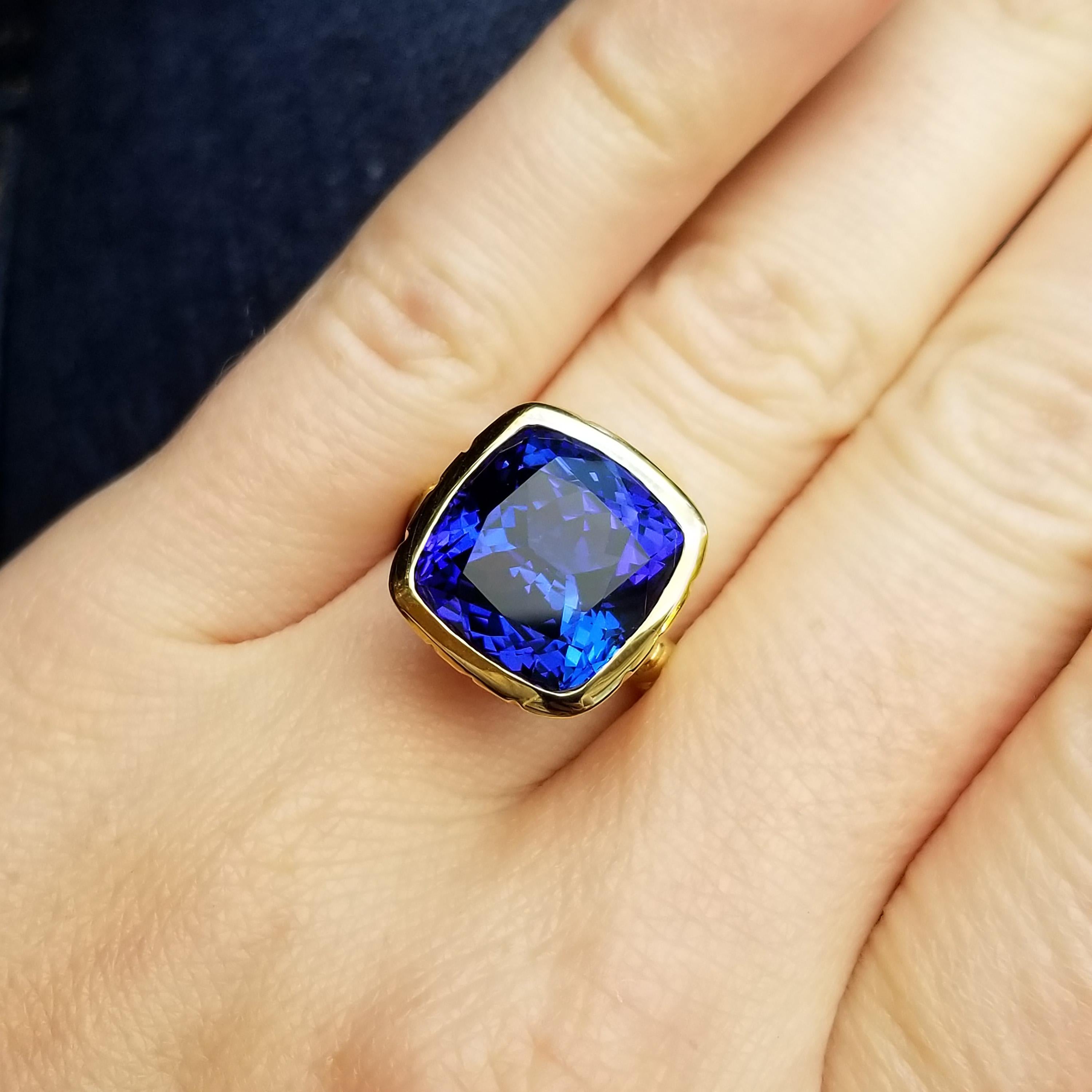 This sumptuous 10.52ct tanzanite is an exceptional specimen. The Tanzanian gem reveals pleochroism with intensely deep blue as well as rich purple each becoming apparent as you tilt this lovely ring back and forth. Additional flashes of red add