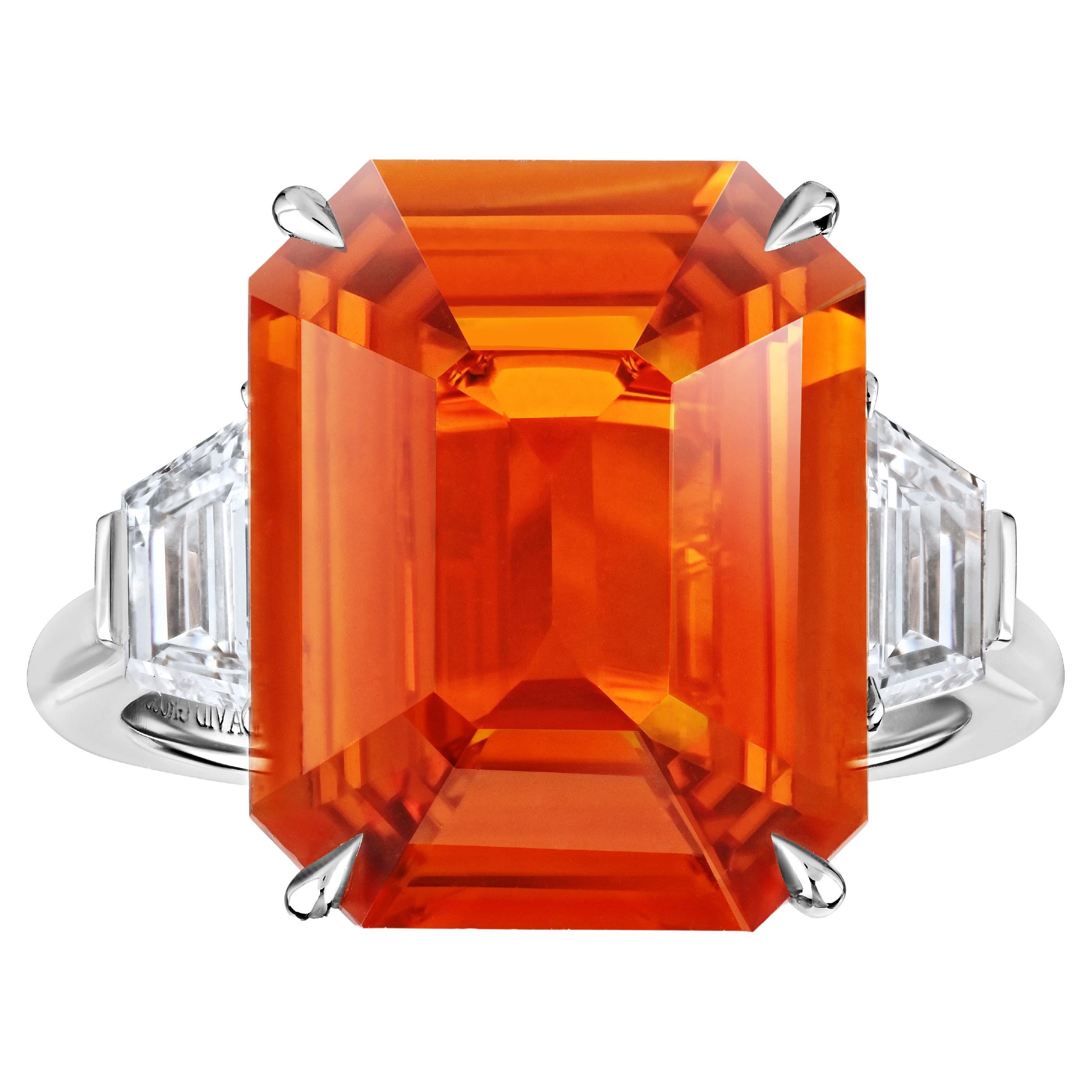 10.53 carat Emerald Cut Orange Sapphire with two Trapezoid Step Cut Diamonds in  For Sale