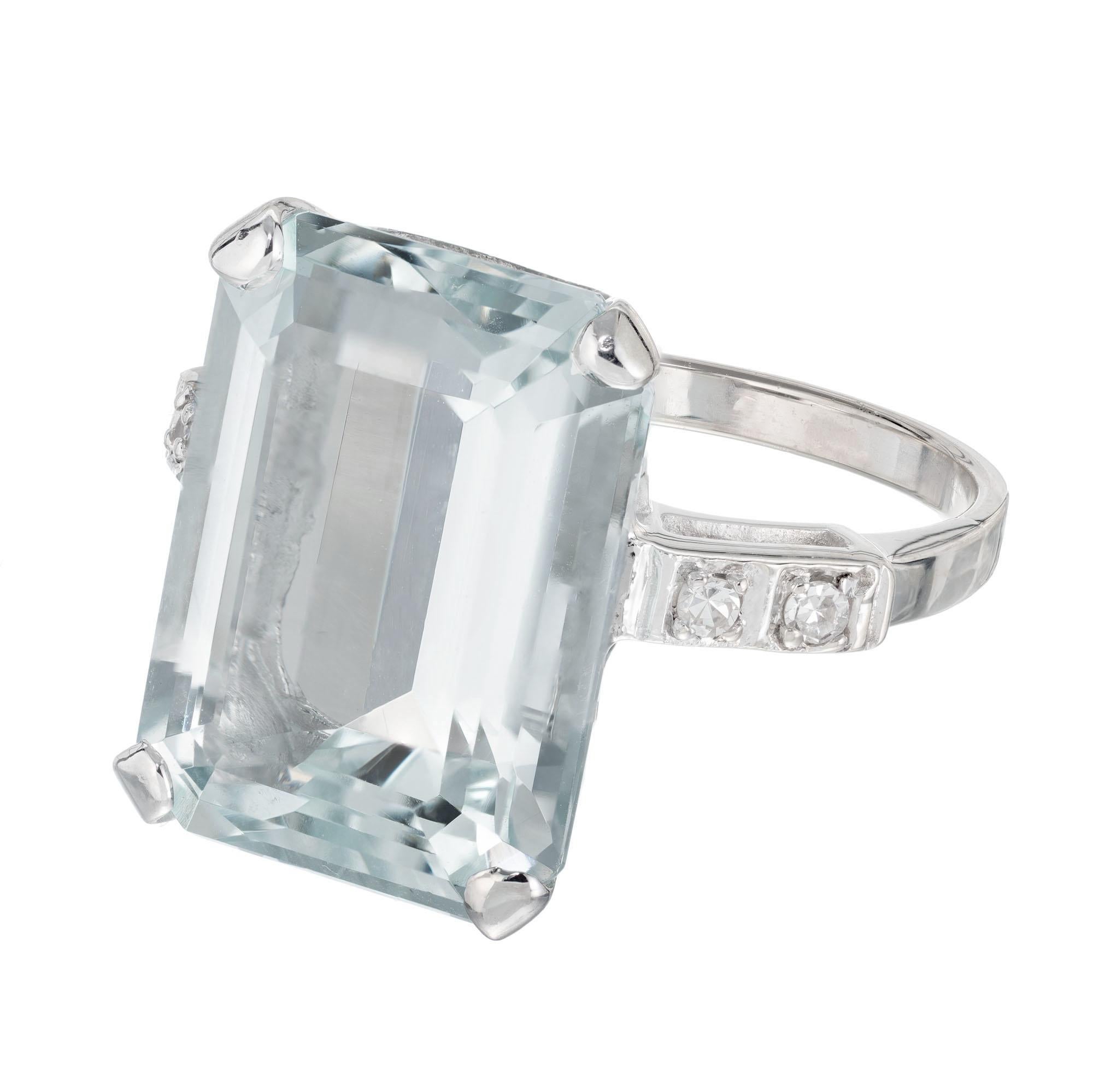 1950's Emerald cut aqua cocktail ring. 10.51 carat center stone in a 14k white gold setting with 4 single cut accent diamonds. 

1 rectangular pale blue aquamarine, approx. 10.51ct
4 round single cut diamond, G-H VS approx..6cts
Size 6.5 and sizable