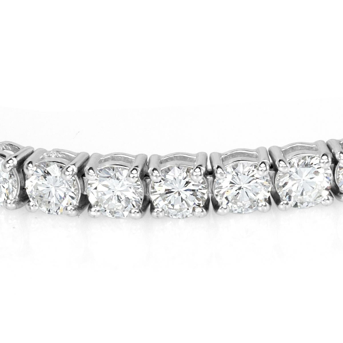 This stunning diamond tennis bracelet showcases 10.55ct of impeccably matched round brilliant cut diamonds graded at F-G in color, VS2-SI1 in clarity. They are set in a custom, 18k white gold setting measuring 7 inches. It truly has unparalleled