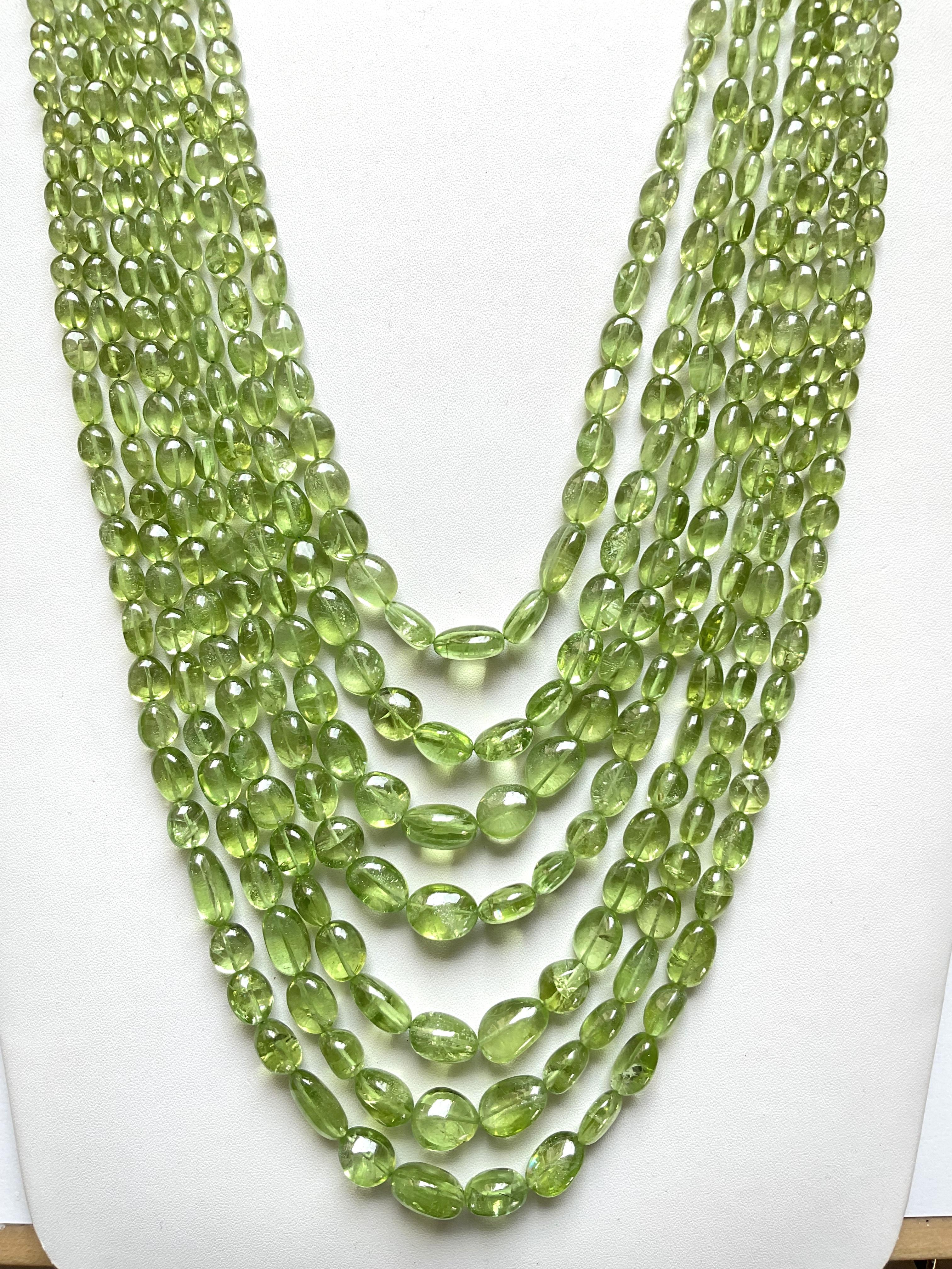 Tumbled 1055.55 carat apple green peridot top quality plain tumbled natural necklace gem For Sale