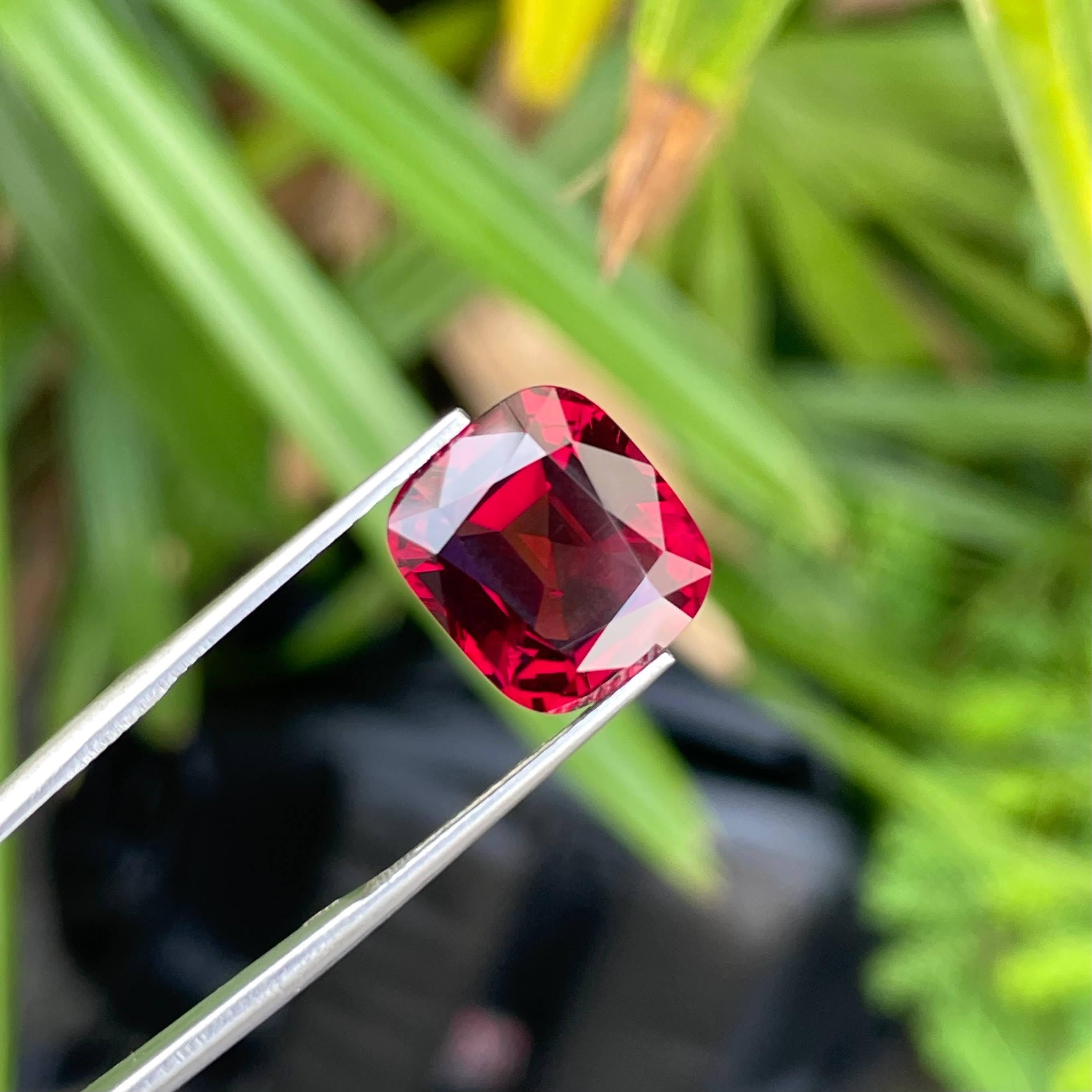 Weight 10.56 carats 
Dimensions 13.3x11.8x7.47 mm
Treatment none 
Origin Madagascar 
Clarity VVS
Shape cushion 
Cut fancy cushion 




The captivating allure of this exquisite gemstone, a stunning Bright Red Garnet, transcends the ordinary,