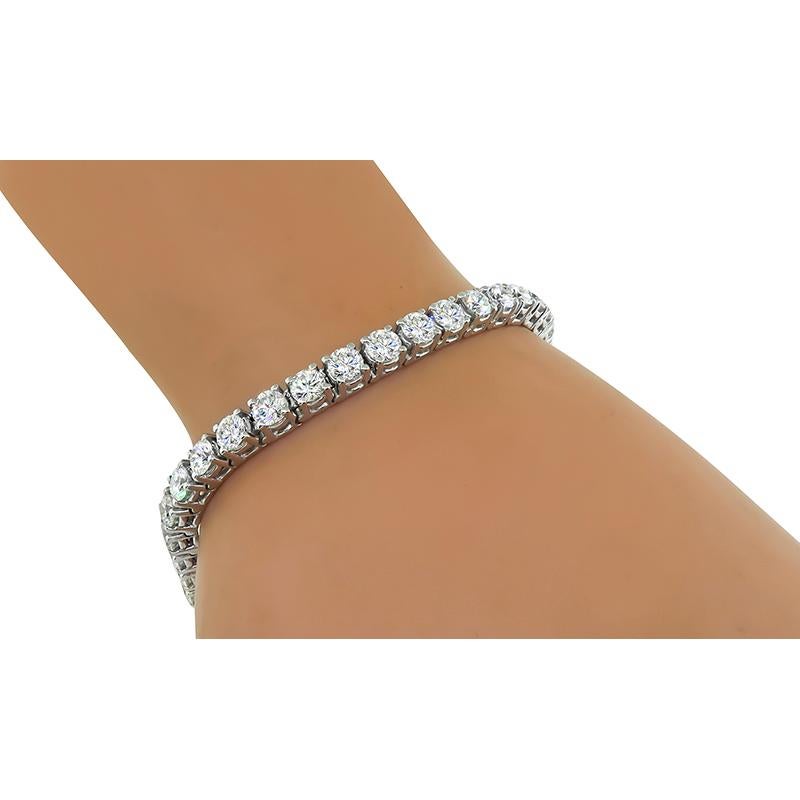 This is a stunning 18k white gold tennis bracelet. The bracelet is set with sparkling round cut diamonds that weigh approximately 10.57ct. The color of these diamonds is E-G with VS clarity. The bracelet measures 4mm in width and 7 inches in length.