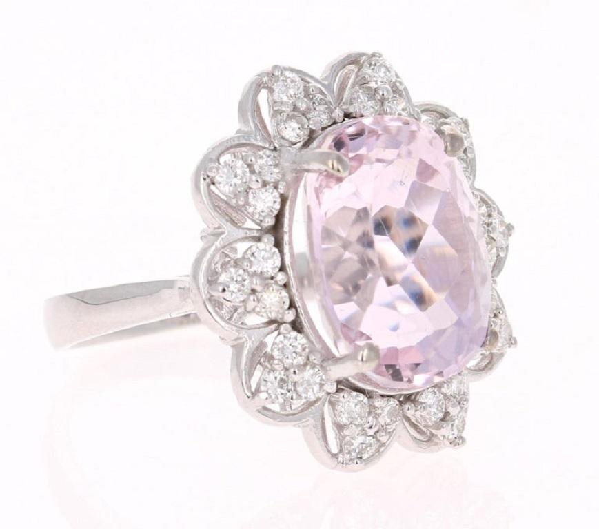 This gorgeous Kunzite Diamond Ring has a 9.85 Carat Oval Cut Kunzite as its center and is surrounded by 30 Round Cut Diamonds that weigh 0.74 carats. The total carat weight of the ring is 10.59 carats.
It is set in 14 Karat White Gold and weighs