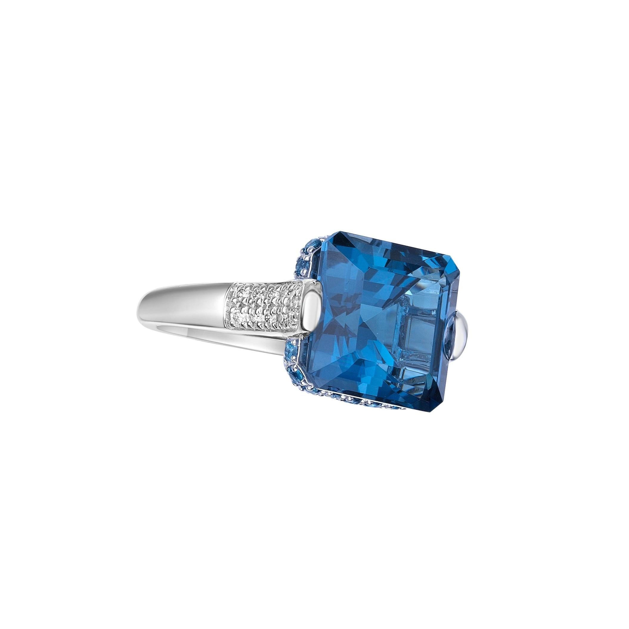Octagon Cut 10.59 Carat London Blue Topaz Fancy Ring in 18KWG with White Diamond. For Sale