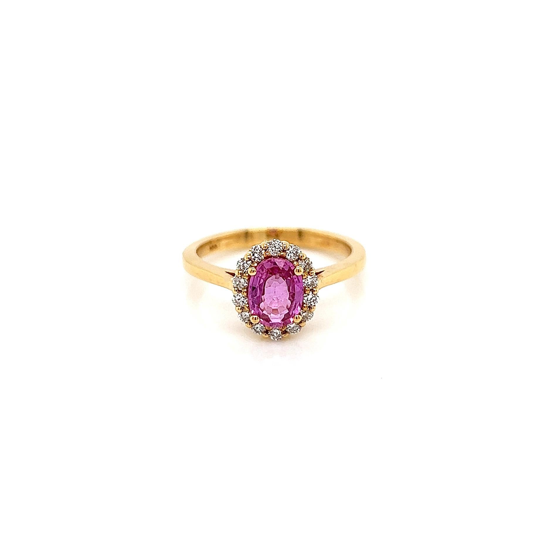 1.33 Total Carat Pink Sapphire Diamond Halo Ladies Ring

-Metal Type: 18K Yellow Gold 
-1.05 Carat Oval Cut Genuine Corundum Pink Sapphire 
-0.28 Carat Round Side Natural Diamonds
-Size 7.0

Made in New York City.