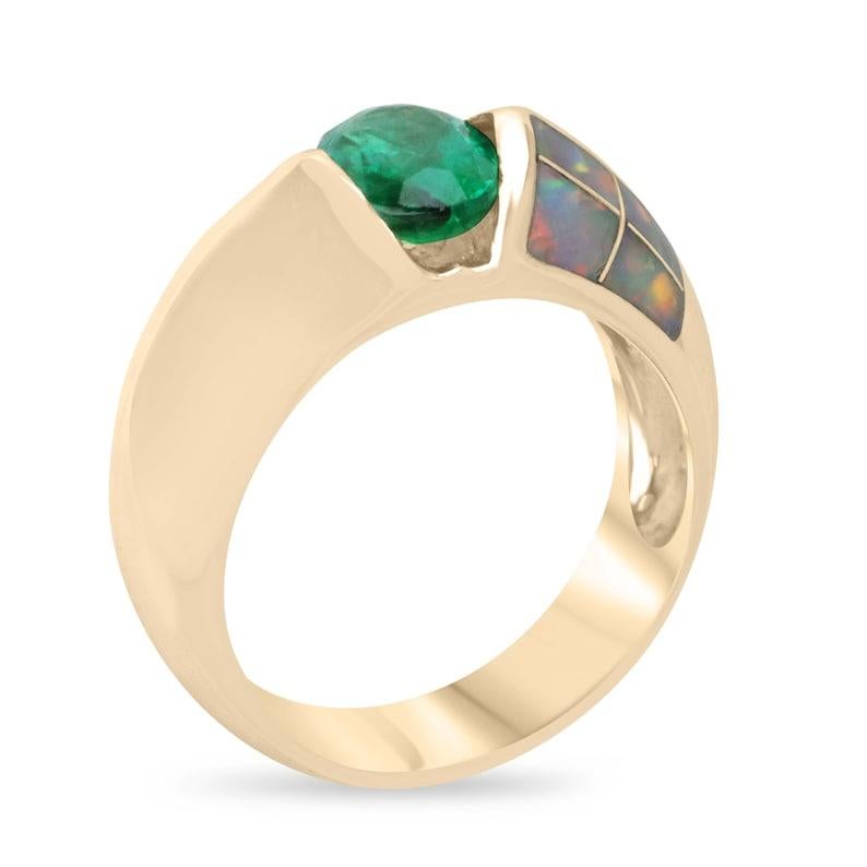Discover the captivating allure of our emerald and opal accent ring, featuring a north-to-south set oval-cut emerald in a bezel setting, displaying a rich green color and very good luster, sourced from Zambia. The emerald is beautifully complemented