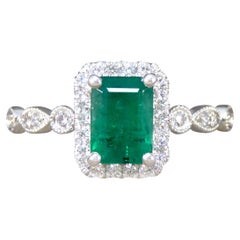 1.05ct Emerald and Diamond Cluster Ring with Diamond Shoulders in Platinum