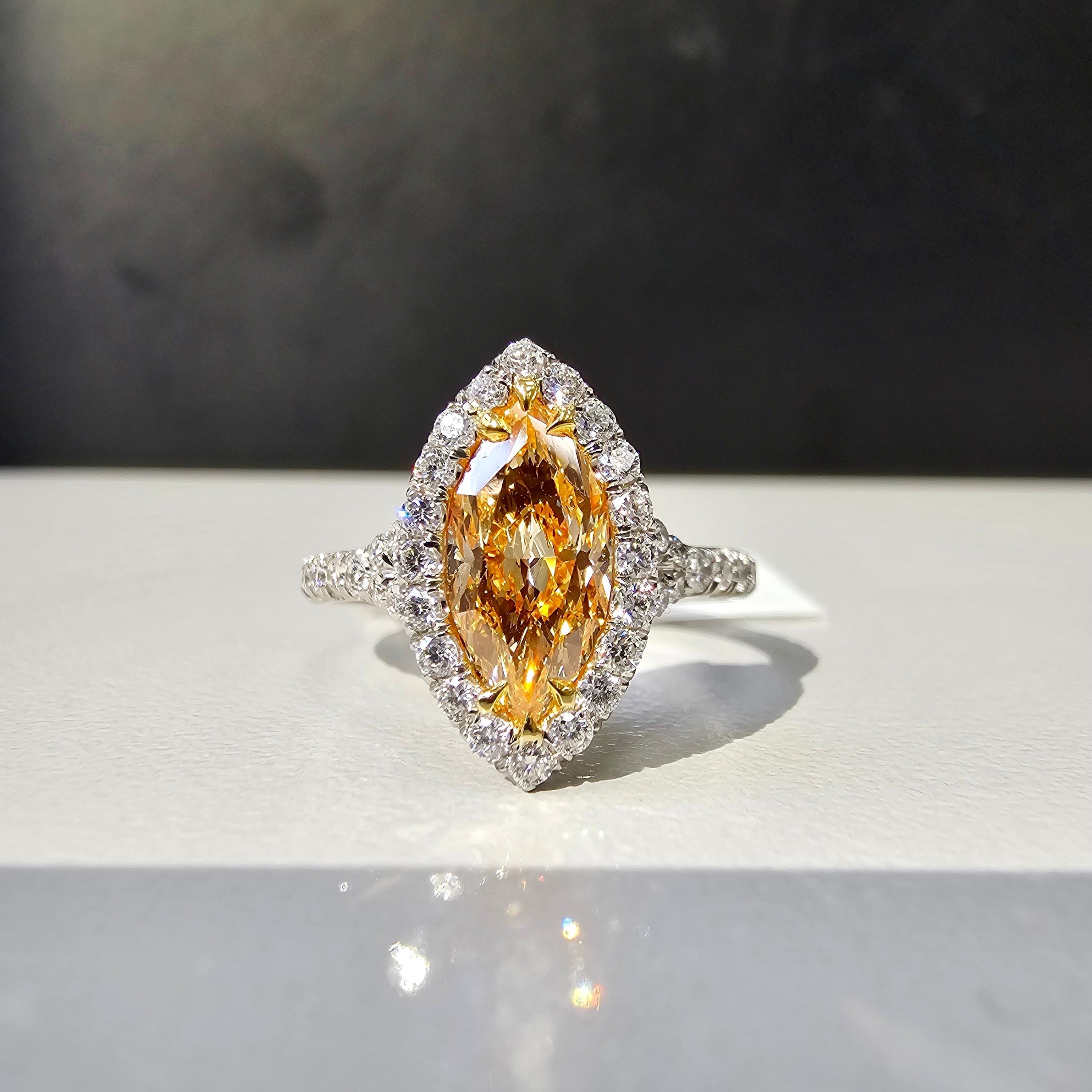 Beautiful Marquise Orange diamond set in a delicate Platinum ring with 0.62ct of rounds
The diamond faces up predominantly orange

Making Extraordinary Attainable with Rare Colors
