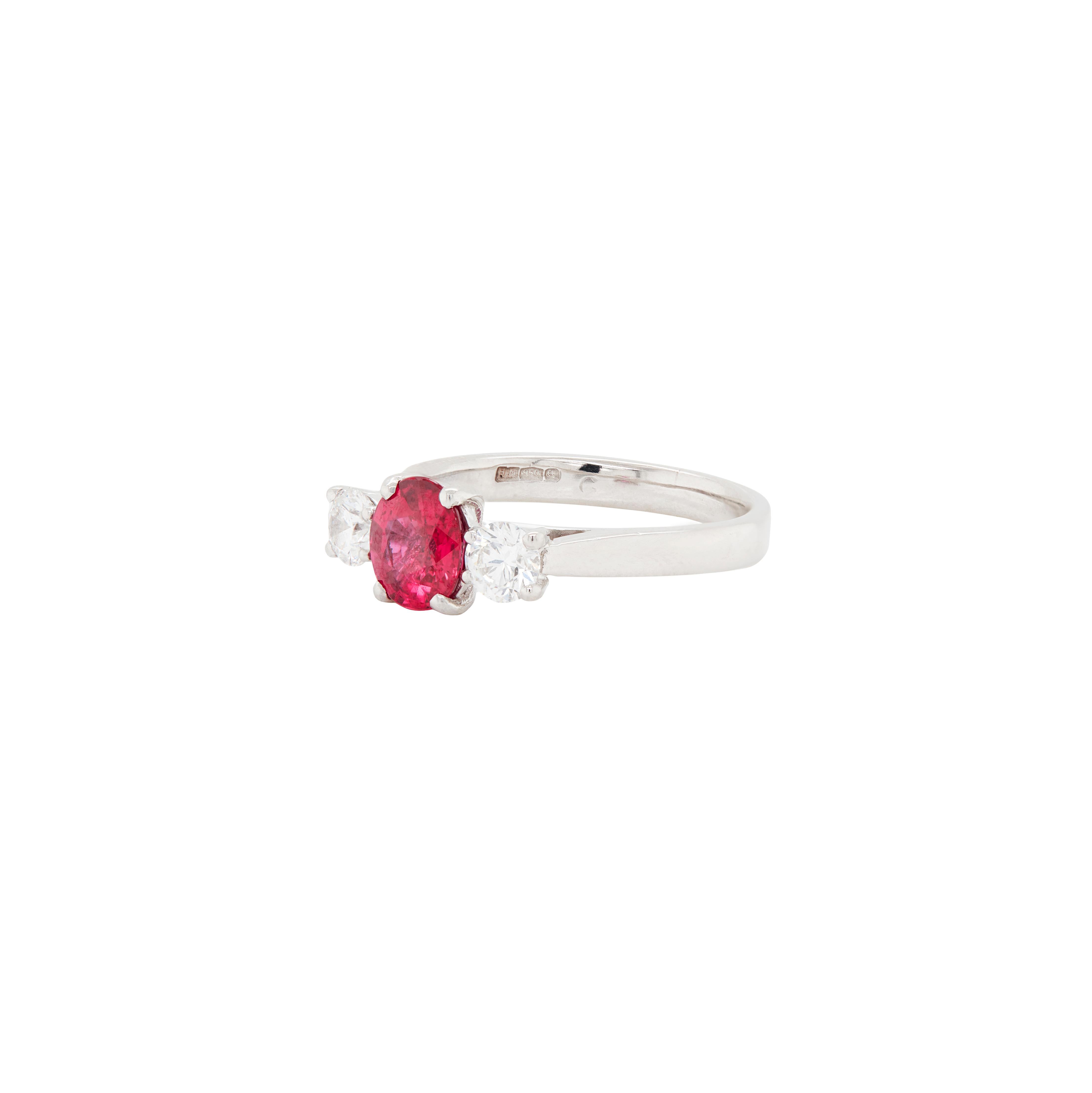 Exquisitely crafted in luxurious 18 carat white gold, this three-stone engagement ring is the perfect piece to express endless love and commitment.

A striking 1.05ct certified oval shaped ruby, rich in vibrant red hues, takes centre stage, securely