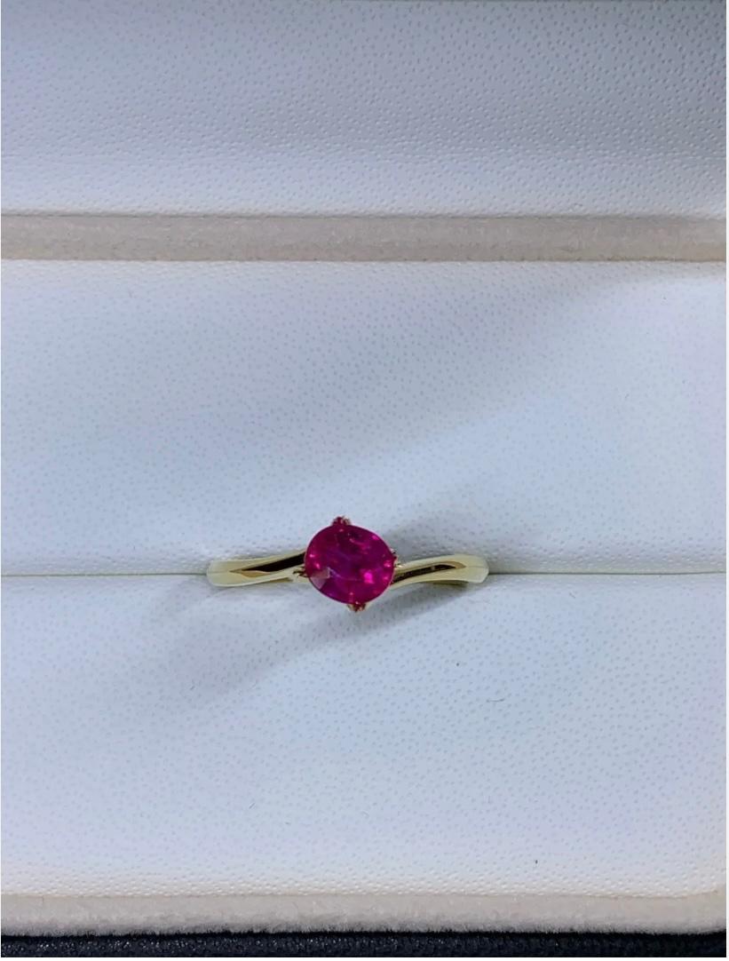 1.05ct Ruby Burma Solitaire Engagement Ring 18ct Yellow Gold
This 1.05ct Ruby Burma Solitaire Engagement Ring is a stunning piece of fine jewellery made with 18ct Yellow Gold. The captivating oval-shaped ruby stone with a natural gold colour is
