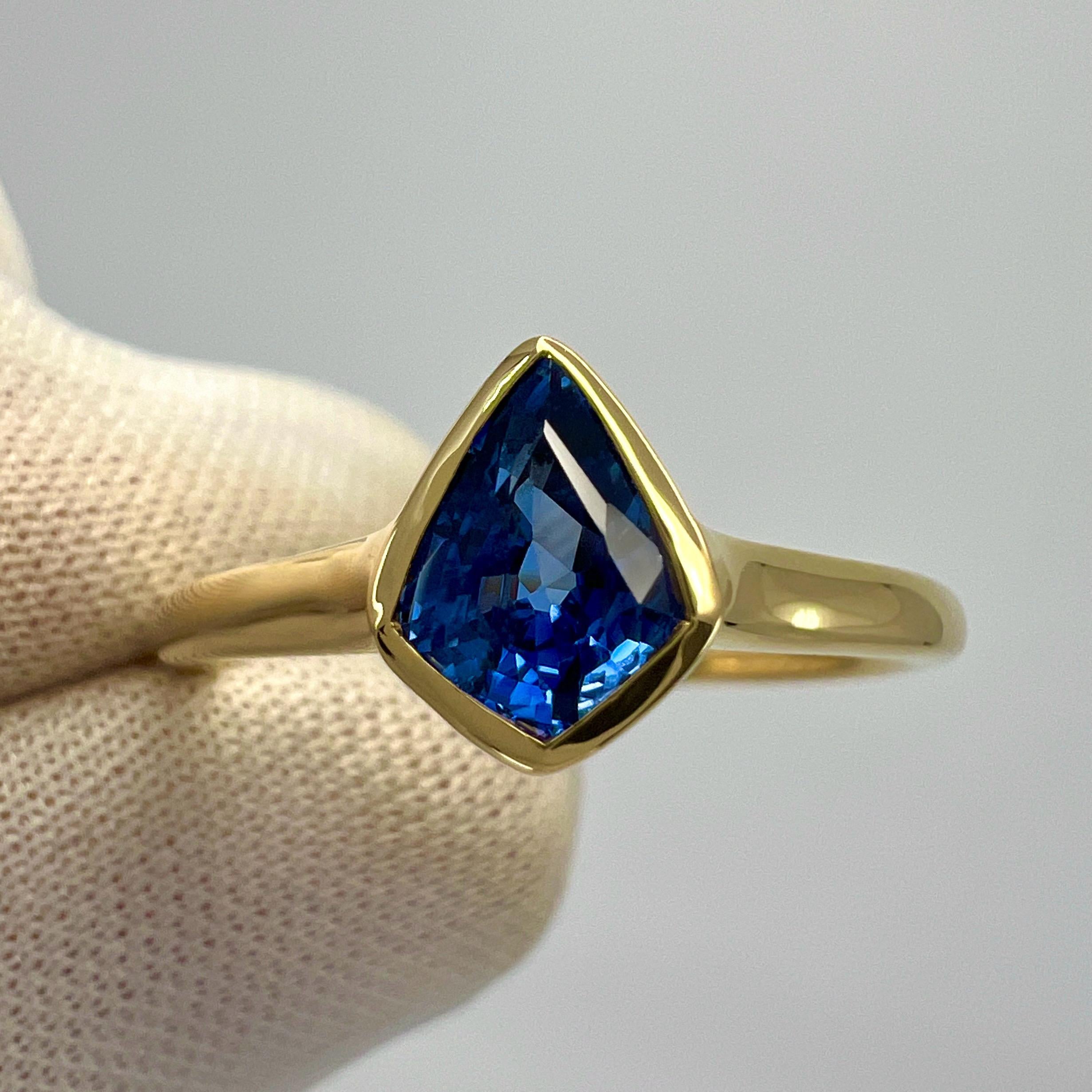 Unique Natural Vivid Blue Ceylon Sapphire 18k Yellow Gold Fancy Kite Cut Solitaire Ring

This beautiful ring features a top grade 1.05ct natural sapphire with a fine vivid cornflower blue colour and an excellent fancy kite cut. Measures approx.