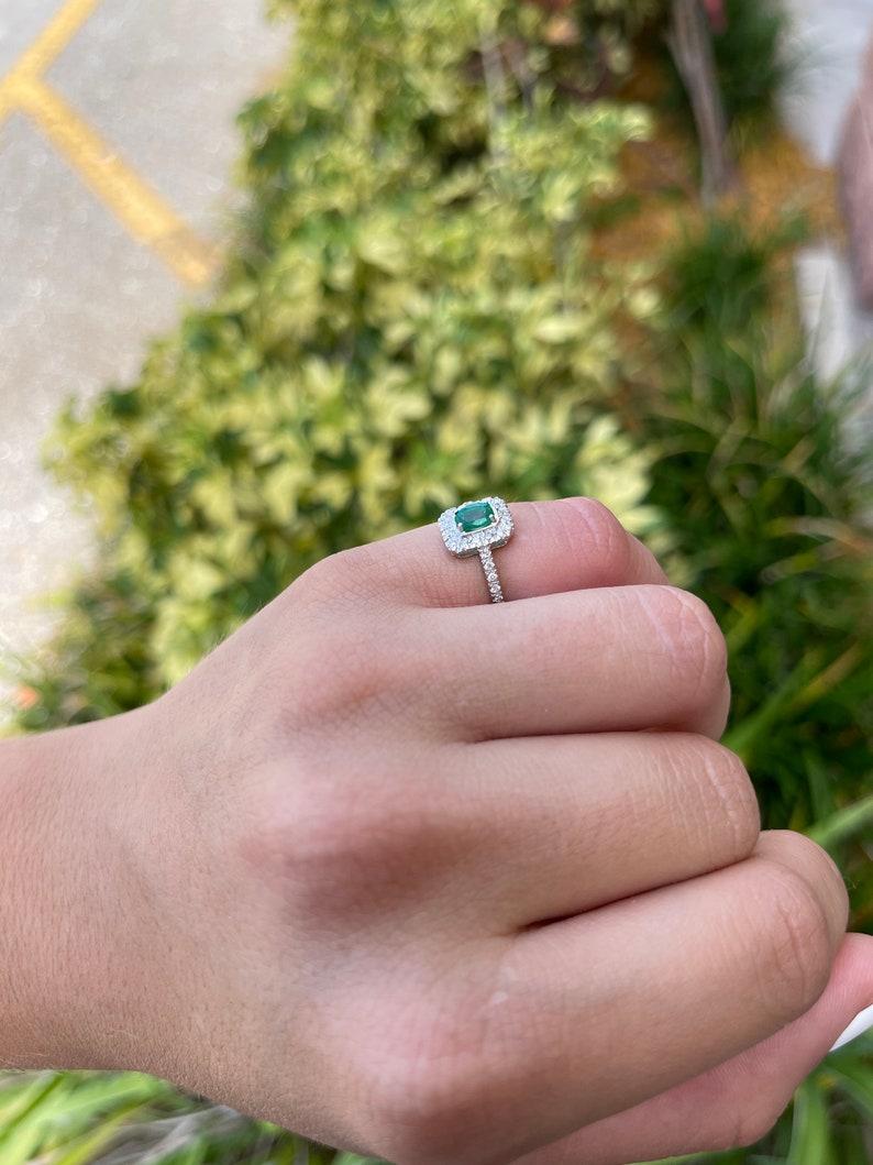 Emerald Cut 1.05tcw 18K Emerald Oval Cut & Diamond Halo and Shank Engagement Ring For Sale