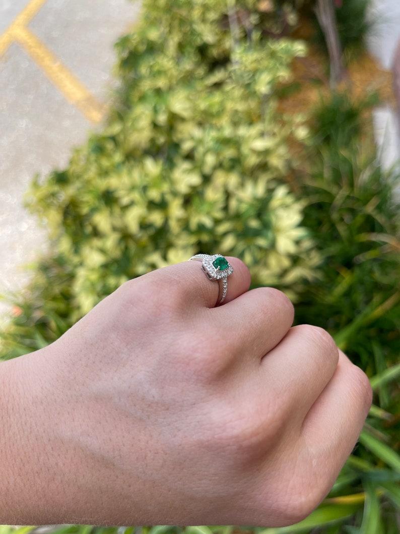 1.05tcw 18K Emerald Oval Cut & Diamond Halo and Shank Engagement Ring In New Condition For Sale In Jupiter, FL