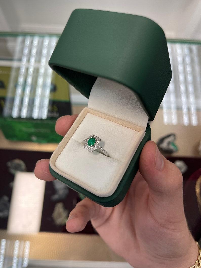 1.05tcw 18K Emerald Oval Cut & Diamond Halo and Shank Engagement Ring For Sale 2