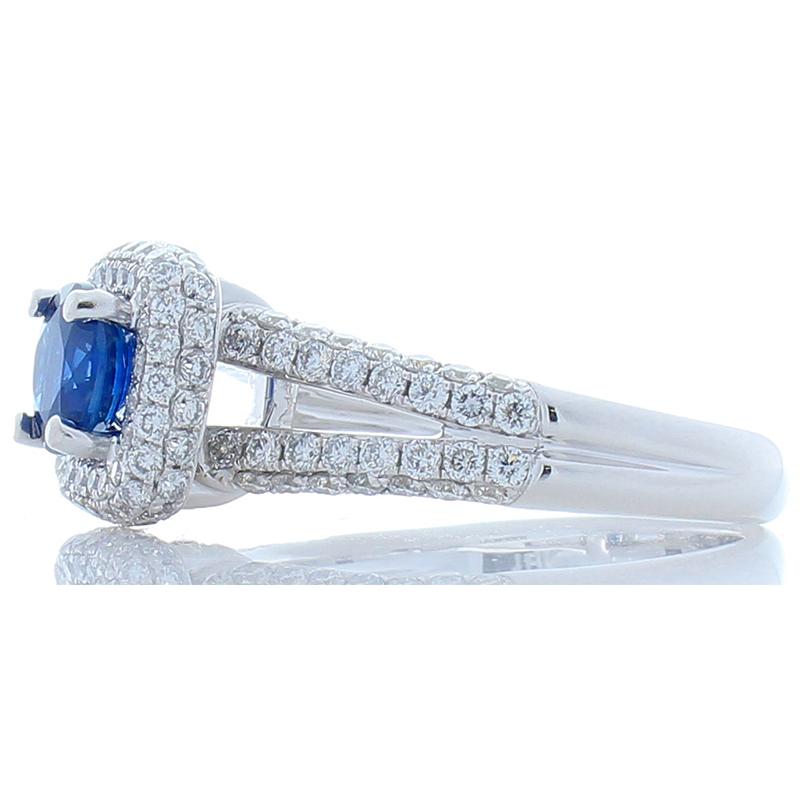Sapphires and diamonds are an exquisite combination that is hard to beat. This ring features a richly hued 1.06 carat round sapphire. The sapphire is a beautiful rich velvet blue. The sapphire is accompanied by a glittering array of pave diamonds,
