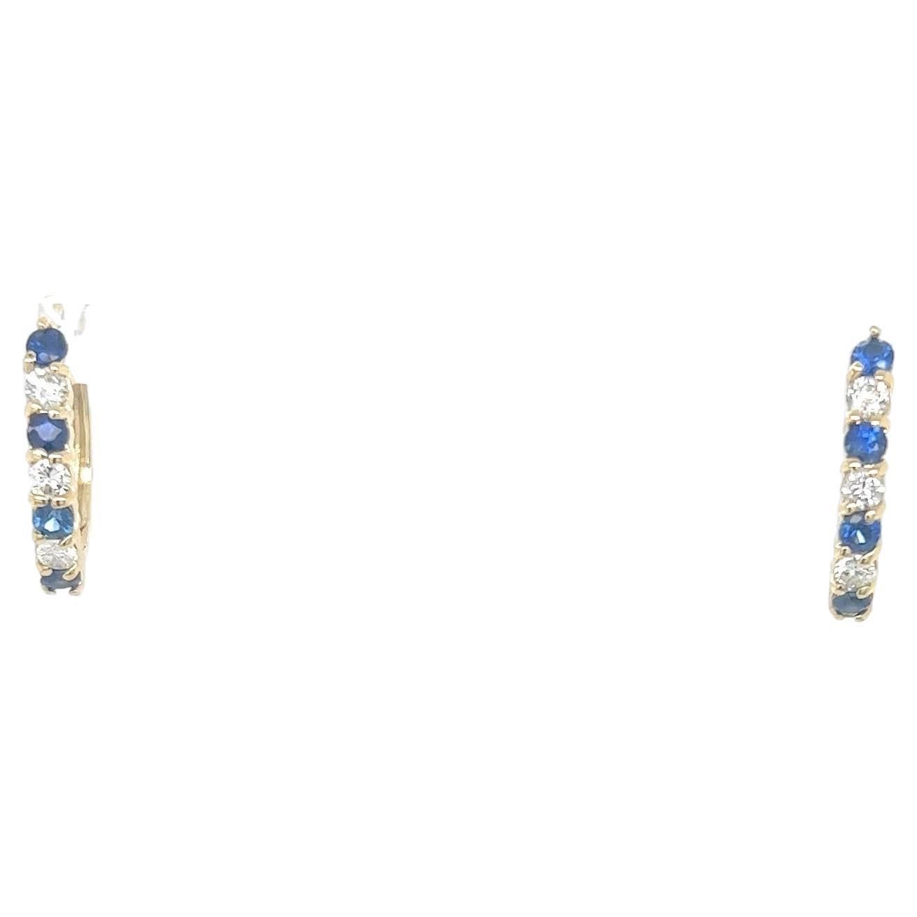 These beautiful earrings have Natural Round Cut Sapphires that weigh 0.70 carats and have Natural Round Cut Diamonds that weigh 0.36 Carats. The total carat weight of the earrings are 1.06 carats. 

They are set in 14 Karat Yellow Gold and weigh