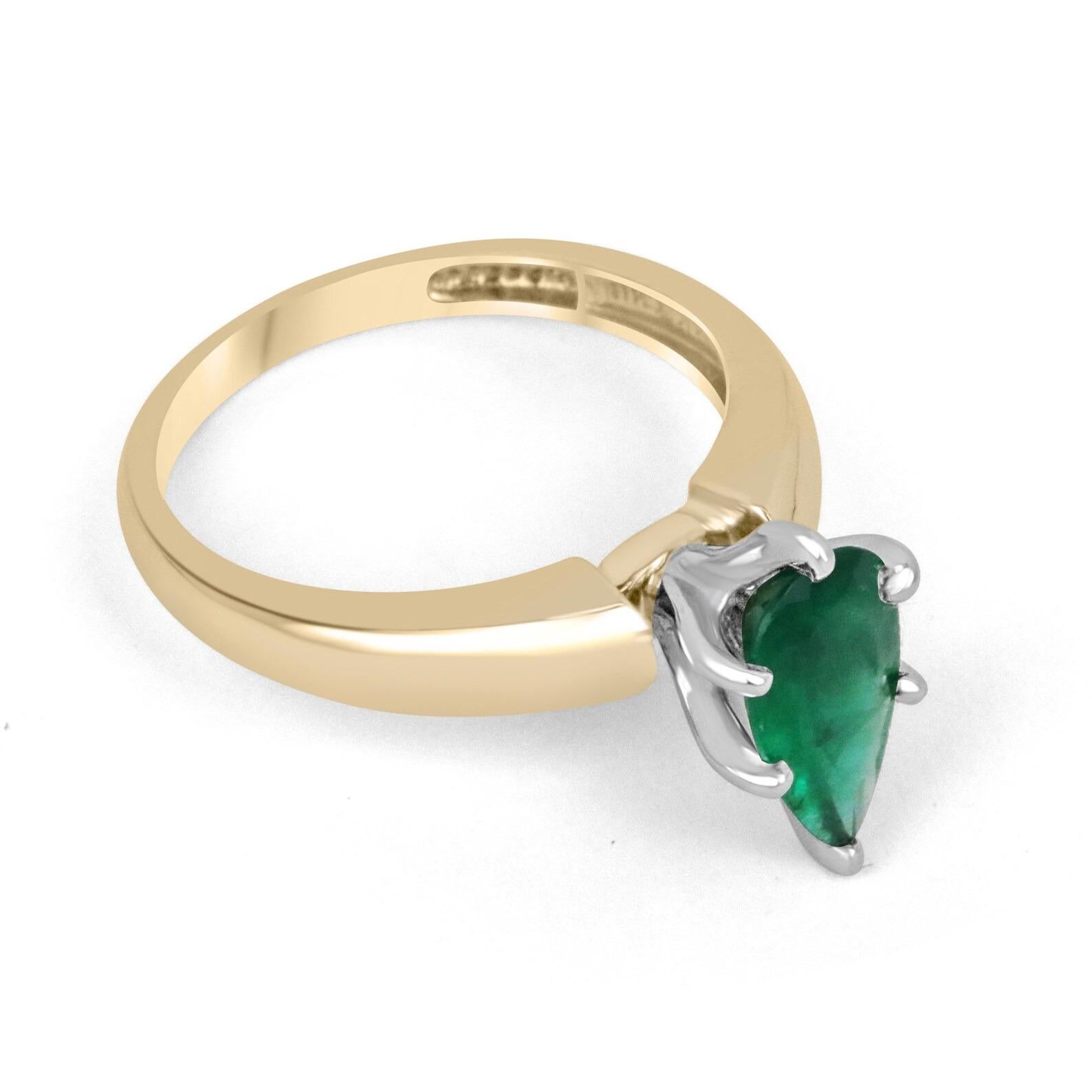 Displayed is a custom emerald solitaire pear-cut engagement/right-hand ring in 14K yellow gold. This gorgeous solitaire ring carries a 1.06-carat emerald in a six-prong setting. The emerald has very good clarity with minor flaws that are normal in