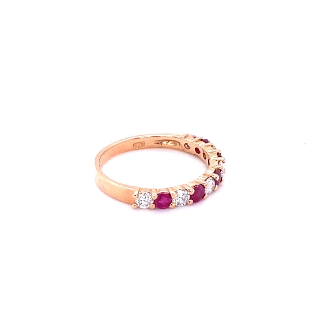 Cute and dainty Ruby and Diamond band that is sure to be a great addition to anyone's accessory collection. There are 5 Round Cut Rubies that weigh 0.58 carats and 6 Round Cut Diamonds that weigh 0.48 carats. The total carat weight of the band is