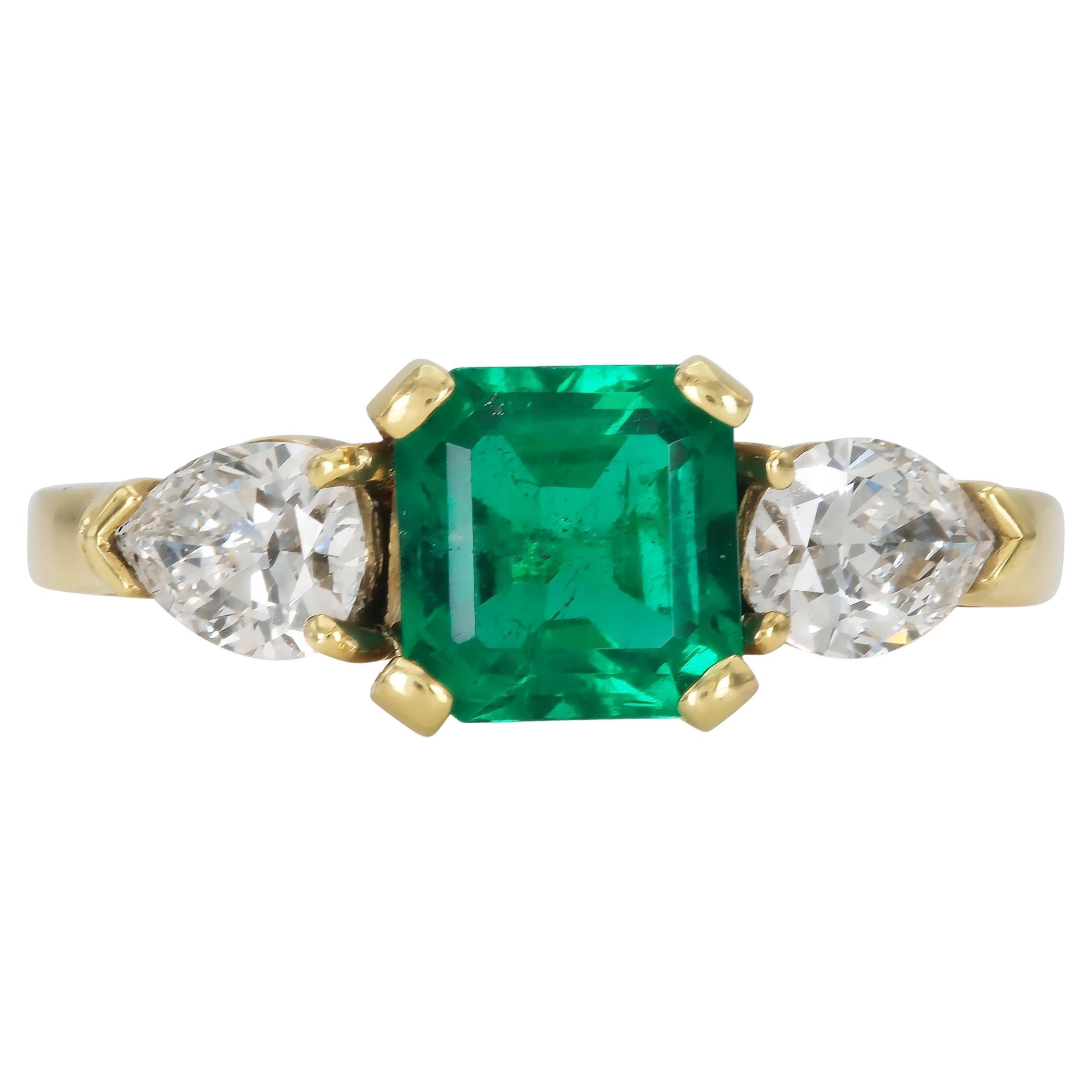 1.06 Carat Emerald cut Ring With Pear Shaped Diamonds