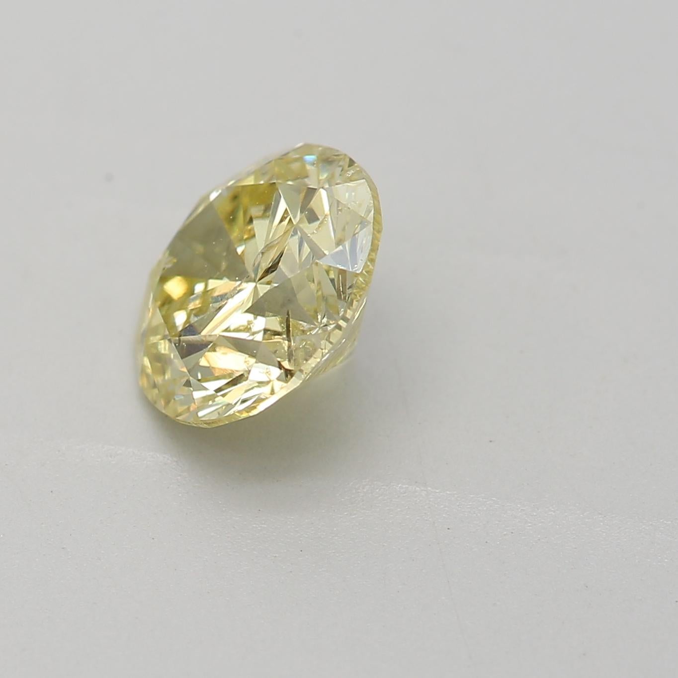 Round Cut 1.06 Carat Fancy Yellow Round cut diamond I3 Clarity GIA Certified For Sale