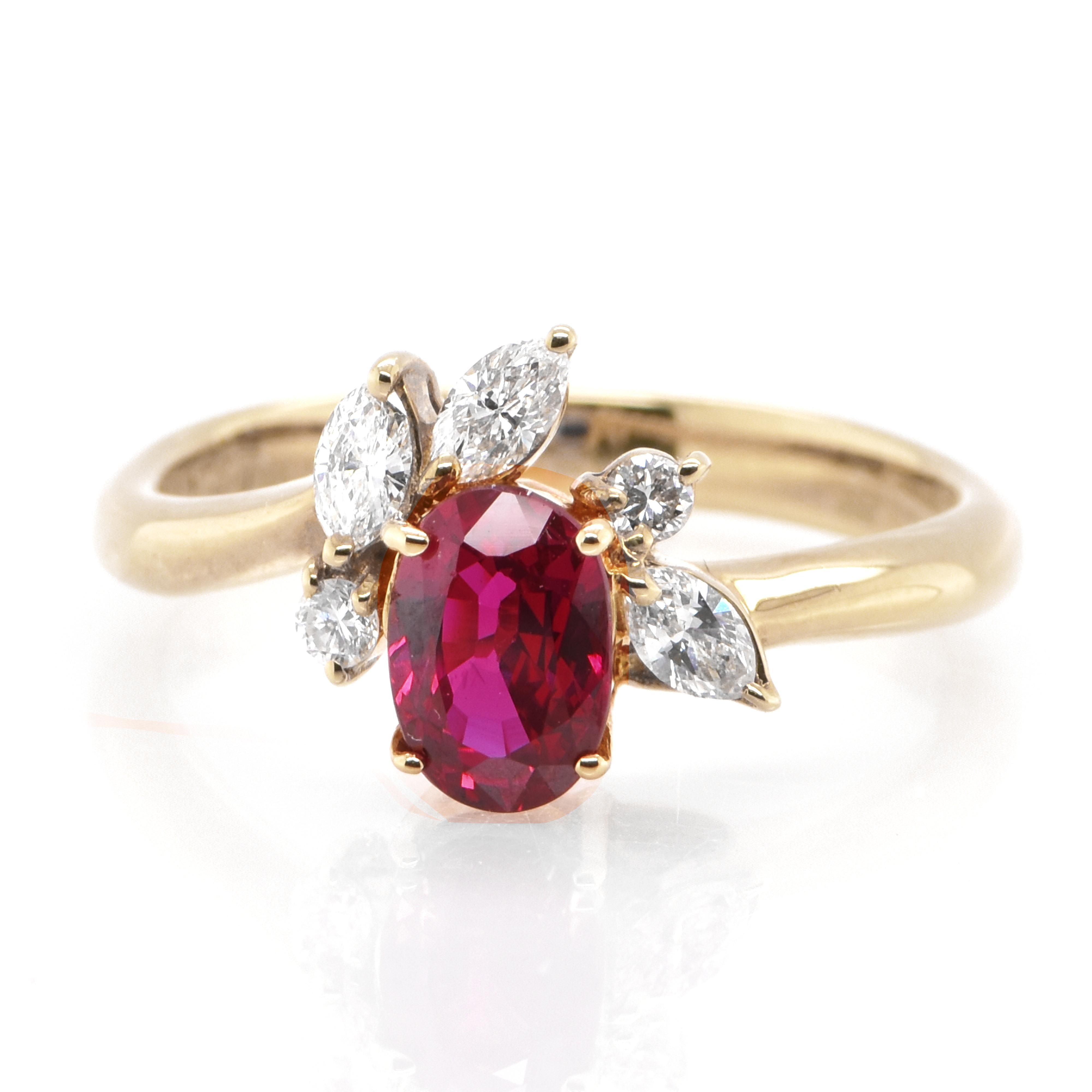 A beautiful ring set in Gold featuring a 1.069 Carat Natural Ruby and 0.27 Carat Diamonds. Rubies are referred to as 