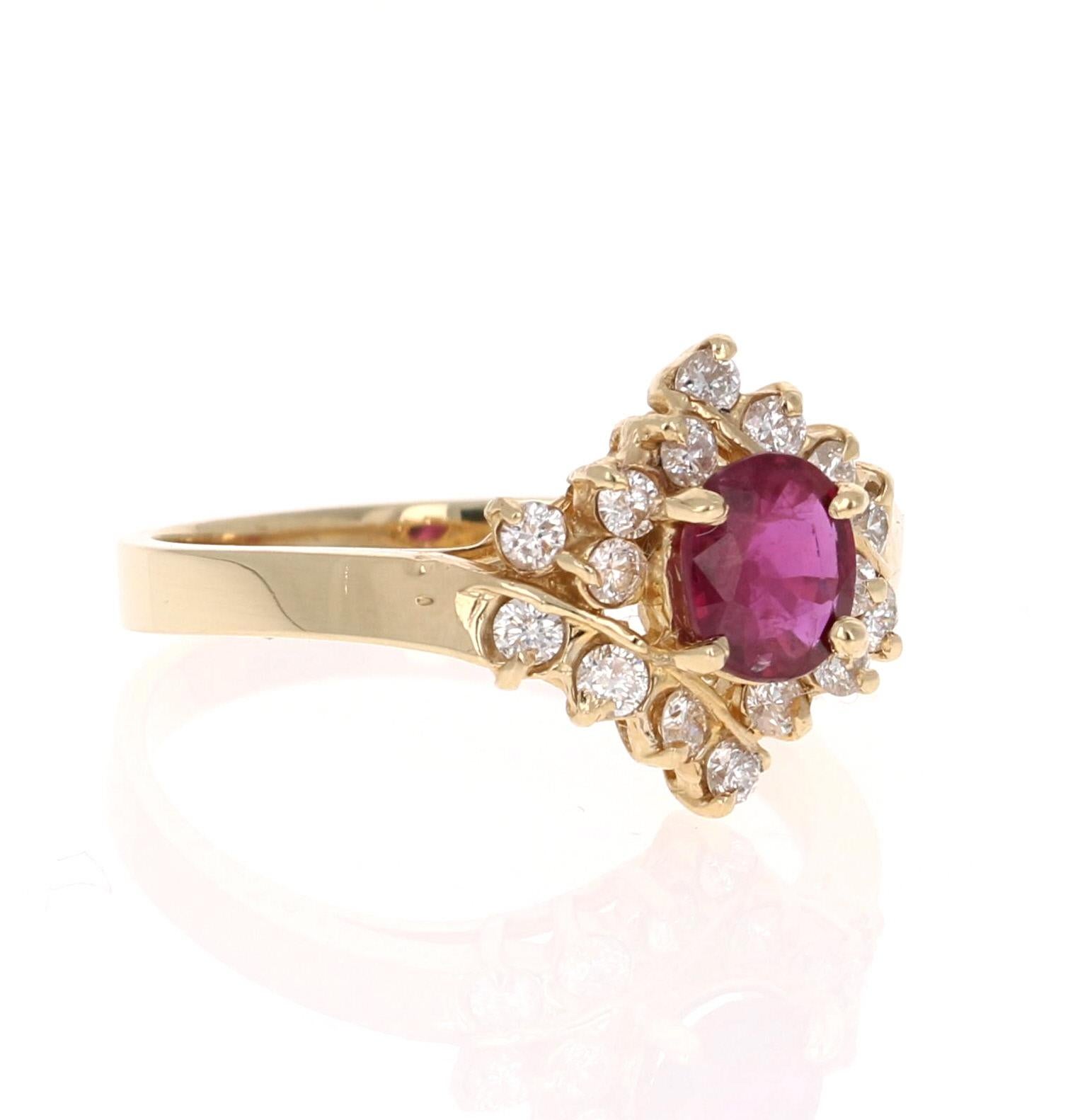 This ring has a 0.69 Carat Oval Cut Burmese Ruby that is set in the center and is surrounded by 16 Round Cut Diamonds that weigh 0.37 carats. The Clarity and Color of the Diamonds is SI-F  The total carat weight of the ring is 1.06 Carats. The