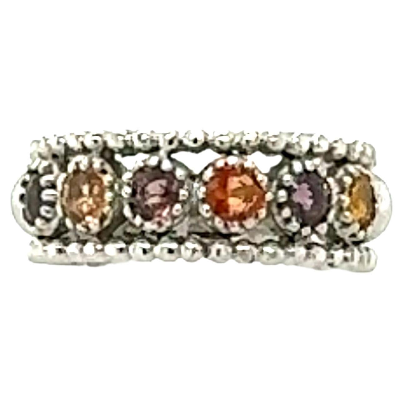 Simple sapphire band in 14K White Gold		

There are 6 Round Cut Natural Multicolor Sapphires with hues of Orange and Yellow that weigh a total of 1.06 carats.  The band looks great stacked with other bands too (*see photos*)
The band is curated in