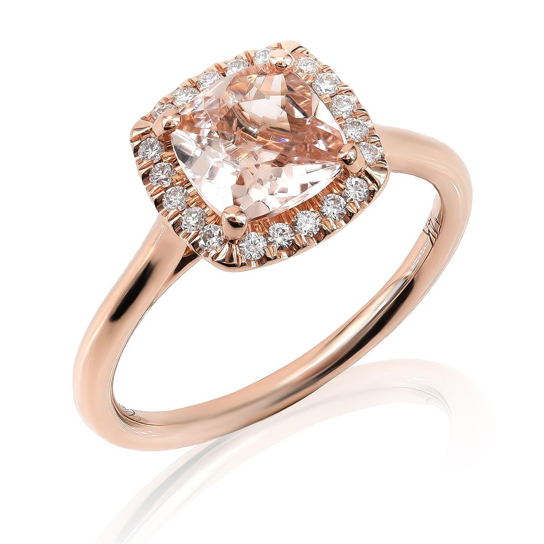 Discover the captivating beauty of this 14K rose gold ring featuring a 1.06 carat cushion shape natural Morganite adorned with 0.15 carats of dazzling diamonds. The soft pink hue of the Morganite pairs elegantly with the rose gold setting, while the