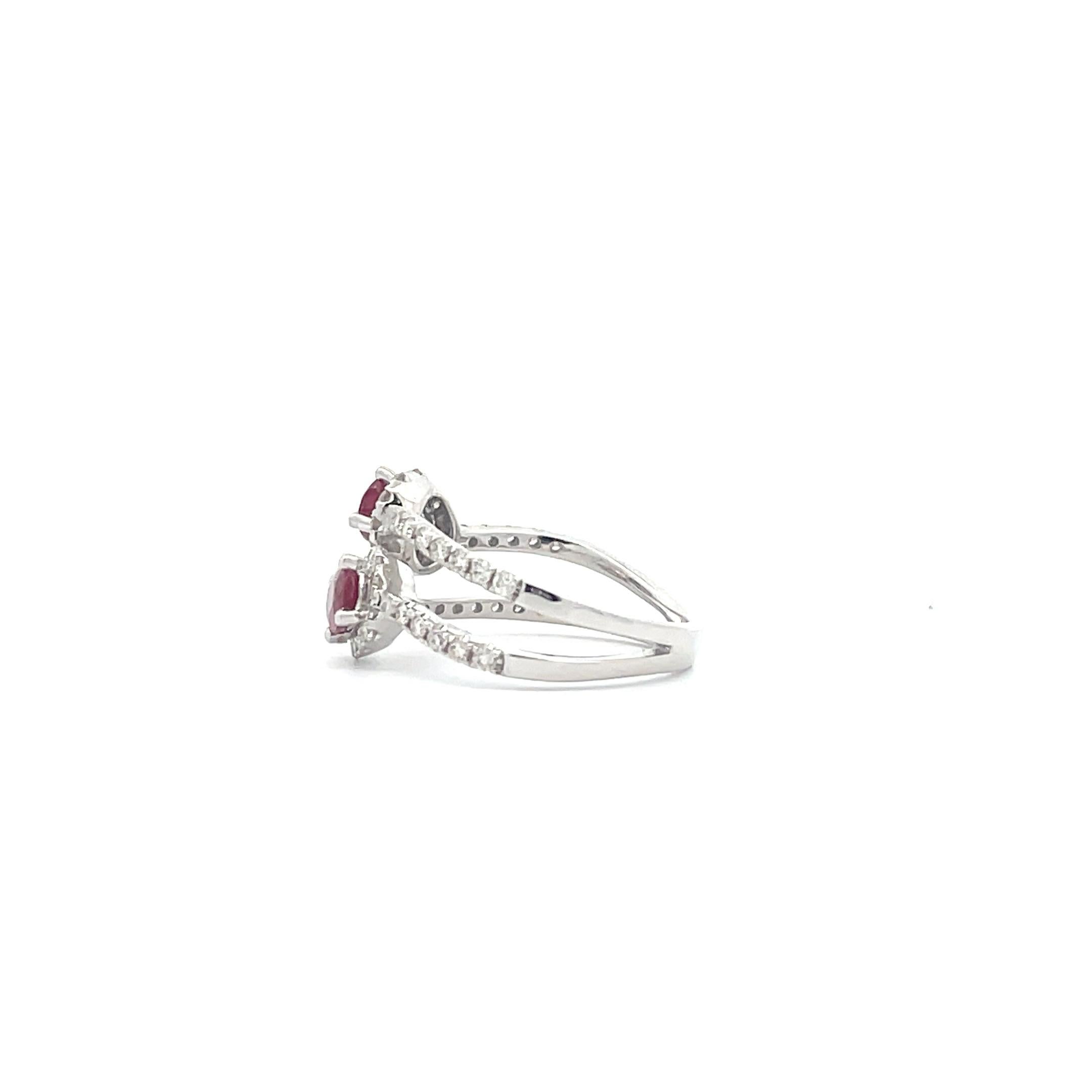 Ruby is said to be the stone of sincerity, and as such, this 1.06 ct. fancy deep red round cut ruby features a double strand design surrounded by dazzling diamonds of 0.63 ct.. Crafted by our professional artisans in 14K White Gold. This delicate,