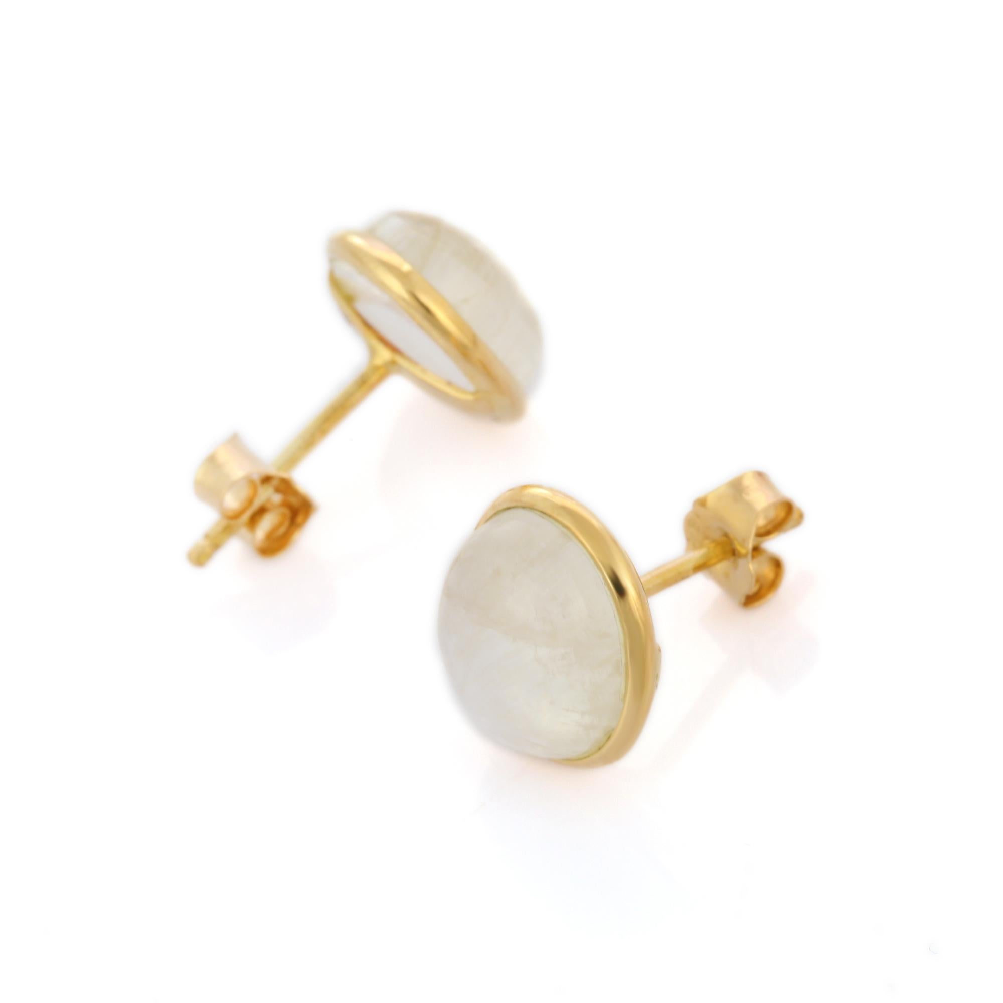 Studs create a subtle beauty while showcasing the colors of the natural precious gemstones.

Dainty oval cut rose moonstone pushback studs in 18K gold. Embrace your look with these stunning pair of earrings suitable for any occasion to complete your