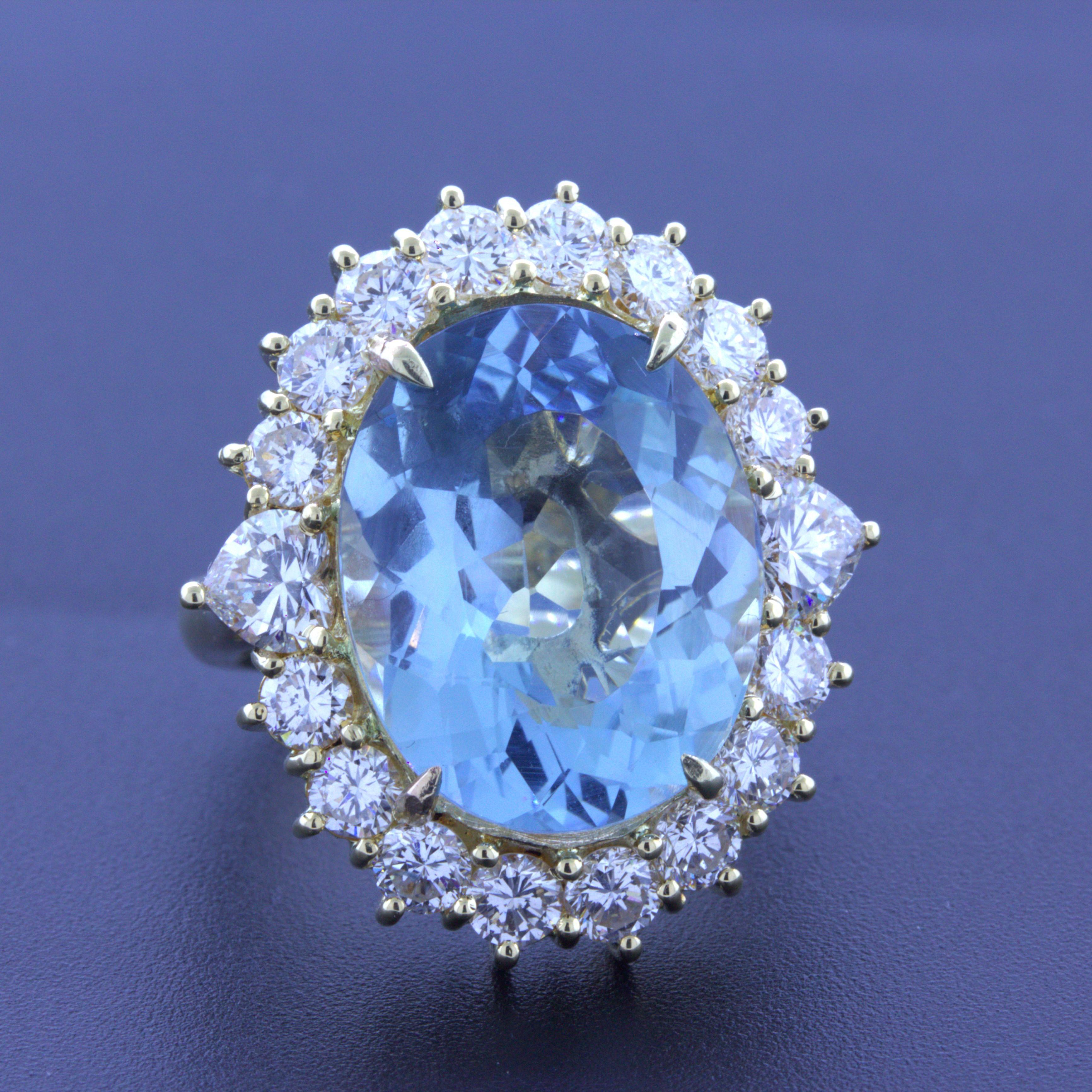 A lovely 18k yellow gold cocktail ring featuring a large 10.60 carat aquamarine. The oval-shape aqua has the classic sea-blue color it is famous for while being extremely clean with no visible inclusions allowing it to shine brightly. It is