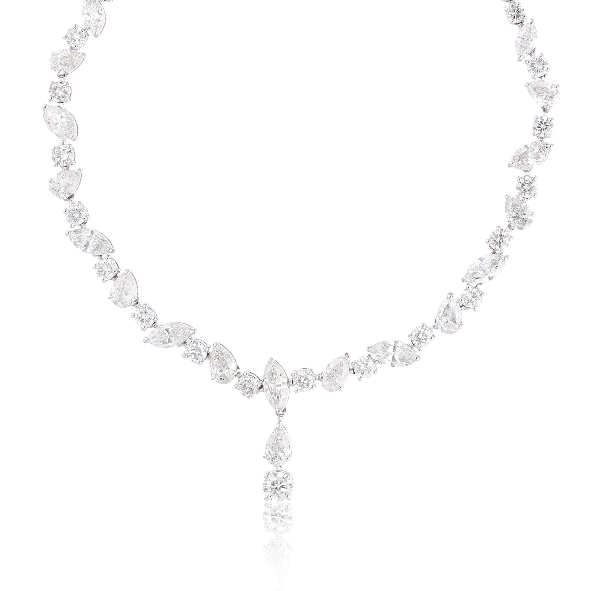 The focal point of this necklace is the dazzling array of diamonds. Each diamond is carefully selected for its exceptional quality, featuring SI clarity and HI color, ensuring a stunning display of brilliance and sparkle. The diamonds are expertly