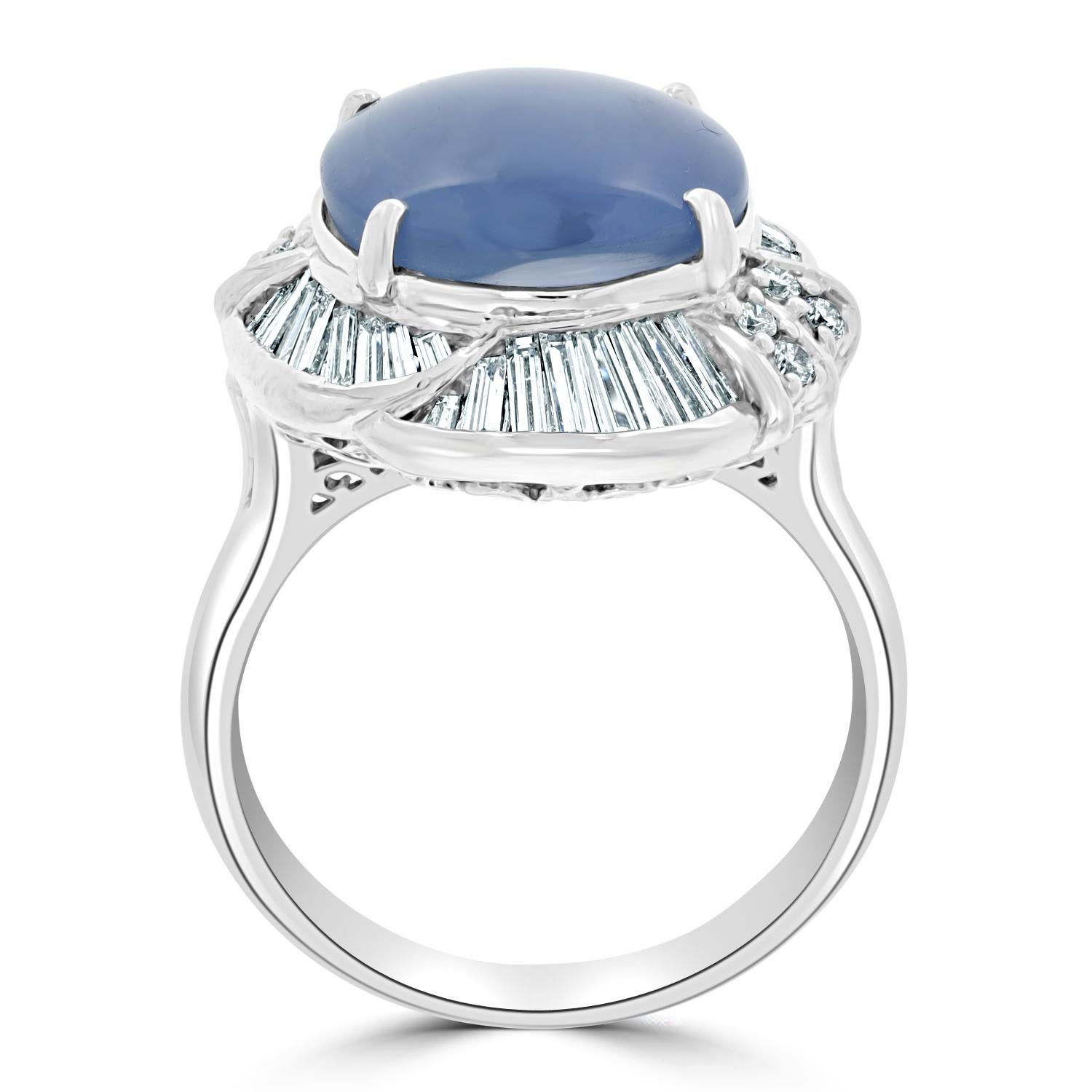 Set with a beautiful round cut Star Sapphire at the center, this stunning ring is crafted from platinum and Diamonds.