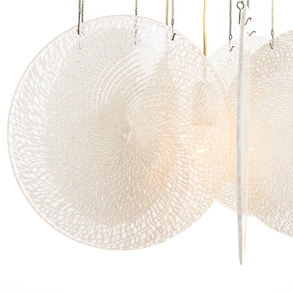 A stylish mid century  glass chandelier by Carlo Nason, Italy.
Six  thick glass swirl lamp shade hanging from steel chains. With a diameter of 37 cm per panel.  One bulb in the center.