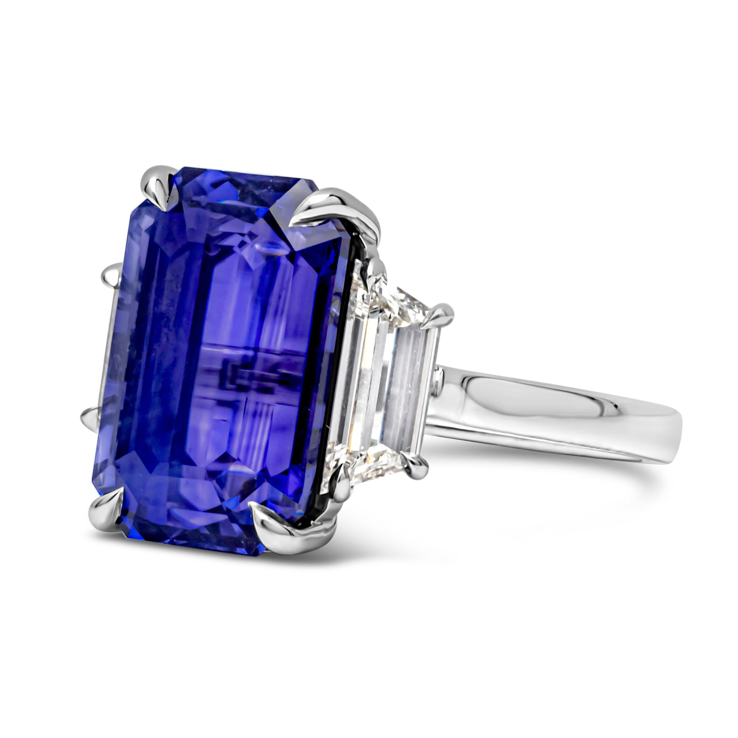 Elegant and well crafted three stone ring features a 10.62 carats emerald cut no-heated color change gemstone blue to purple sapphire certified by GRS as B-P color, set in a classic platinum four prong basket setting. Flanked by two trapezoid